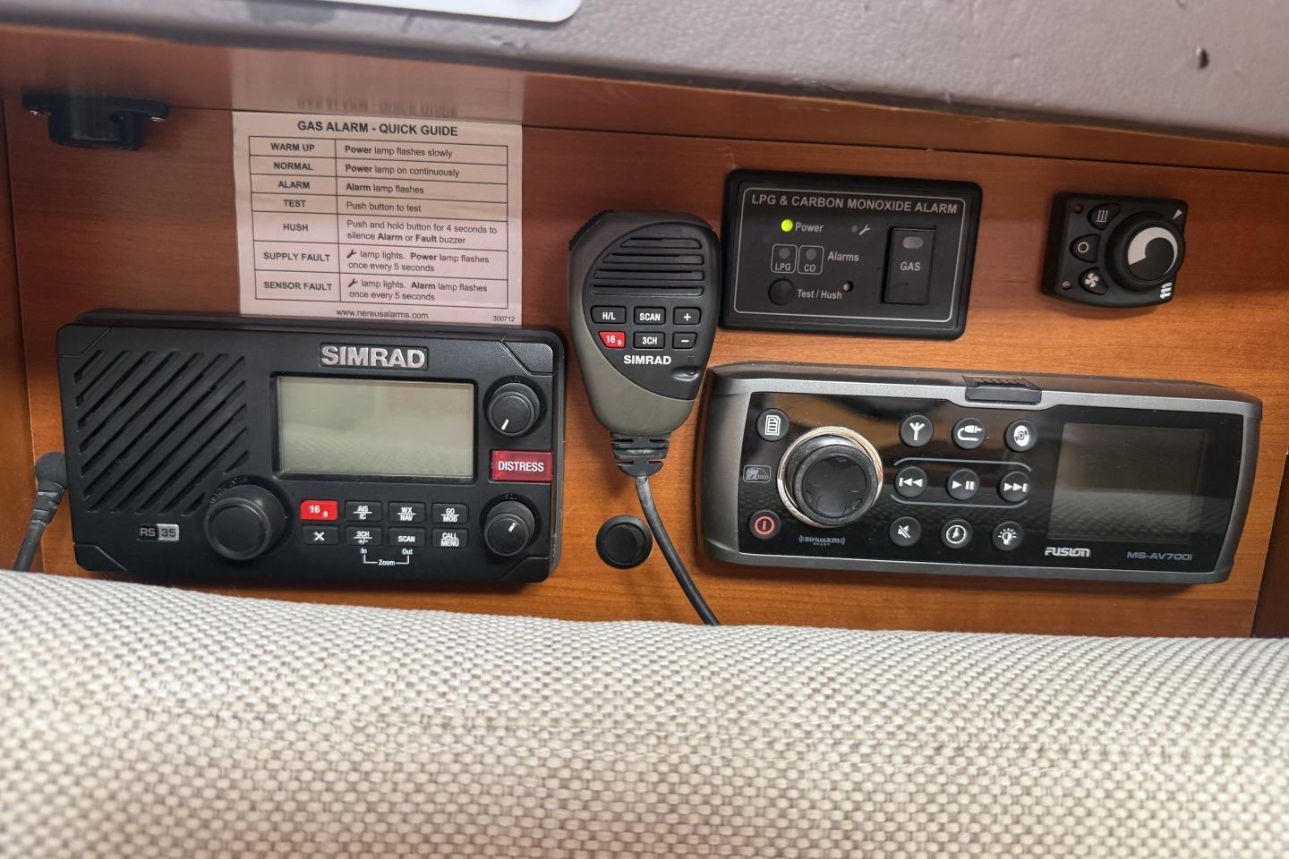Control panel with Simrad radio and Fusion audio system on a 2013 Hanse 415 yacht.