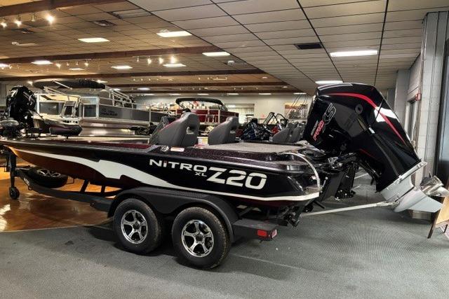 2026 Nitro Z20 XL Pro boat displayed indoors with dual seats and powerful engine.