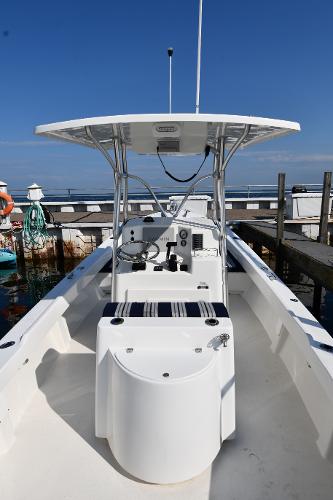 2021 Eastern 248 Center Console boat docked at a marina.