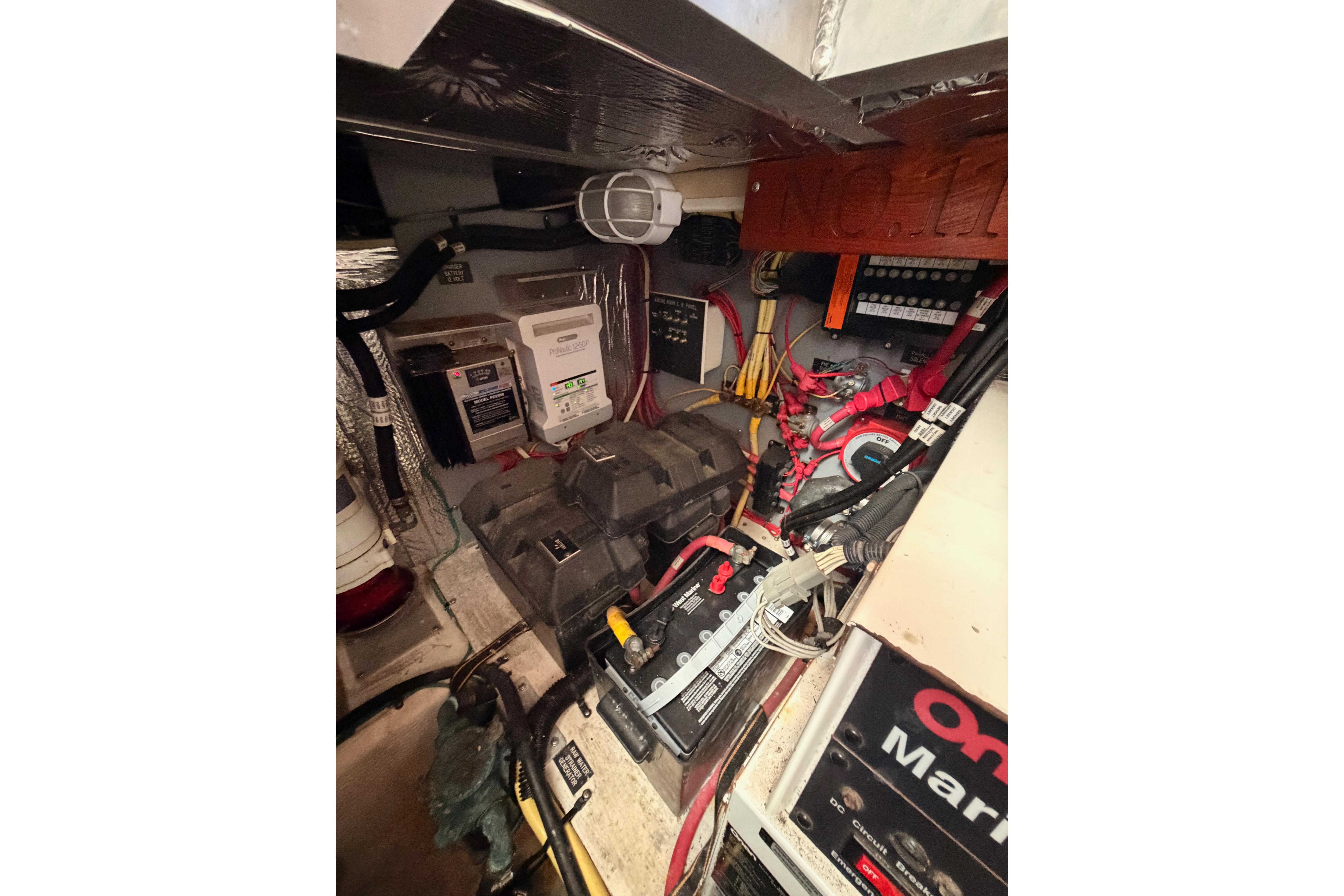 Engine room of 2005 Cruisers Yachts 405 Express Motoryacht with electrical components and wiring.