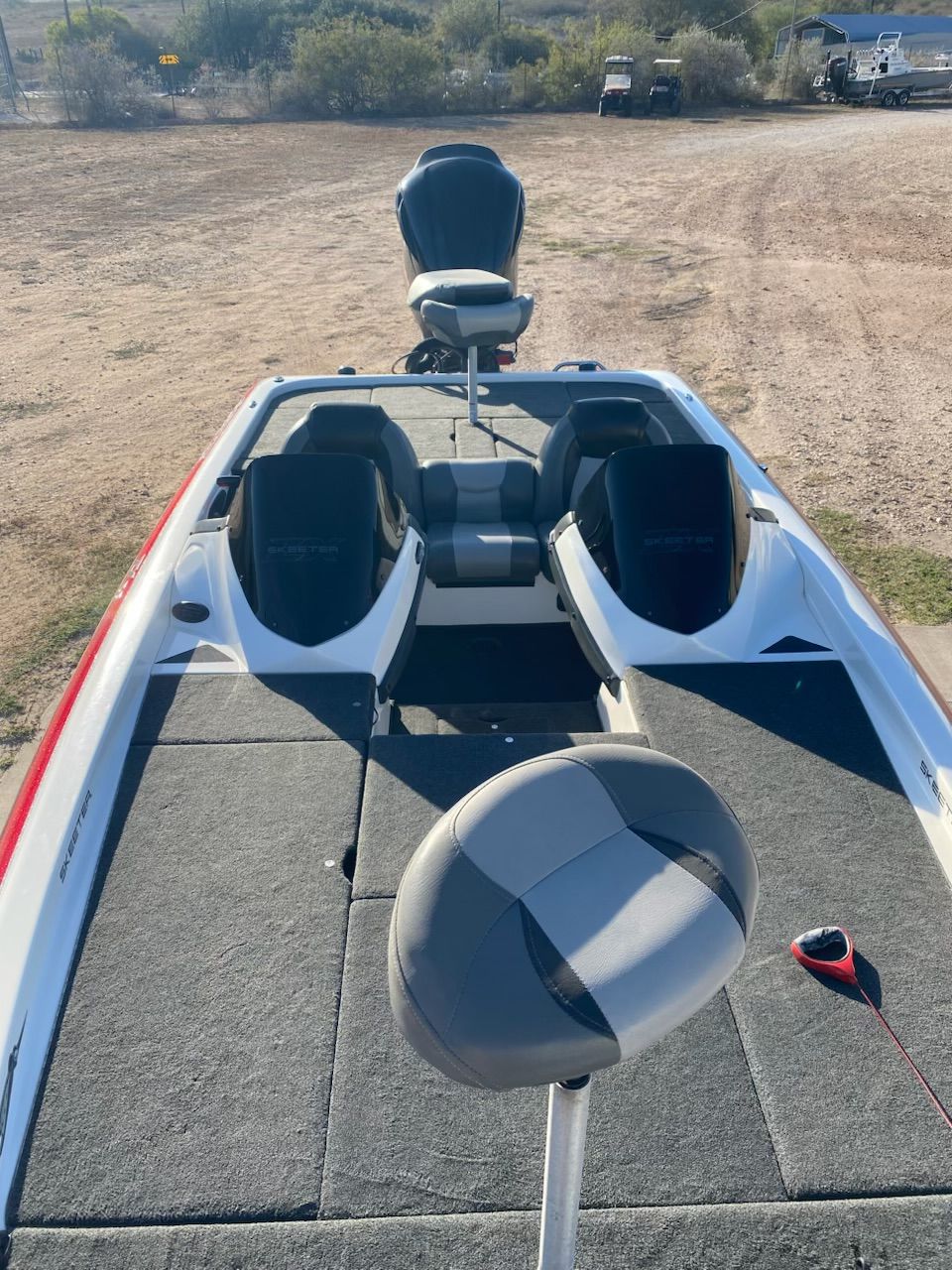 2012 Skeeter ZX20 boat with seating and gray carpet.