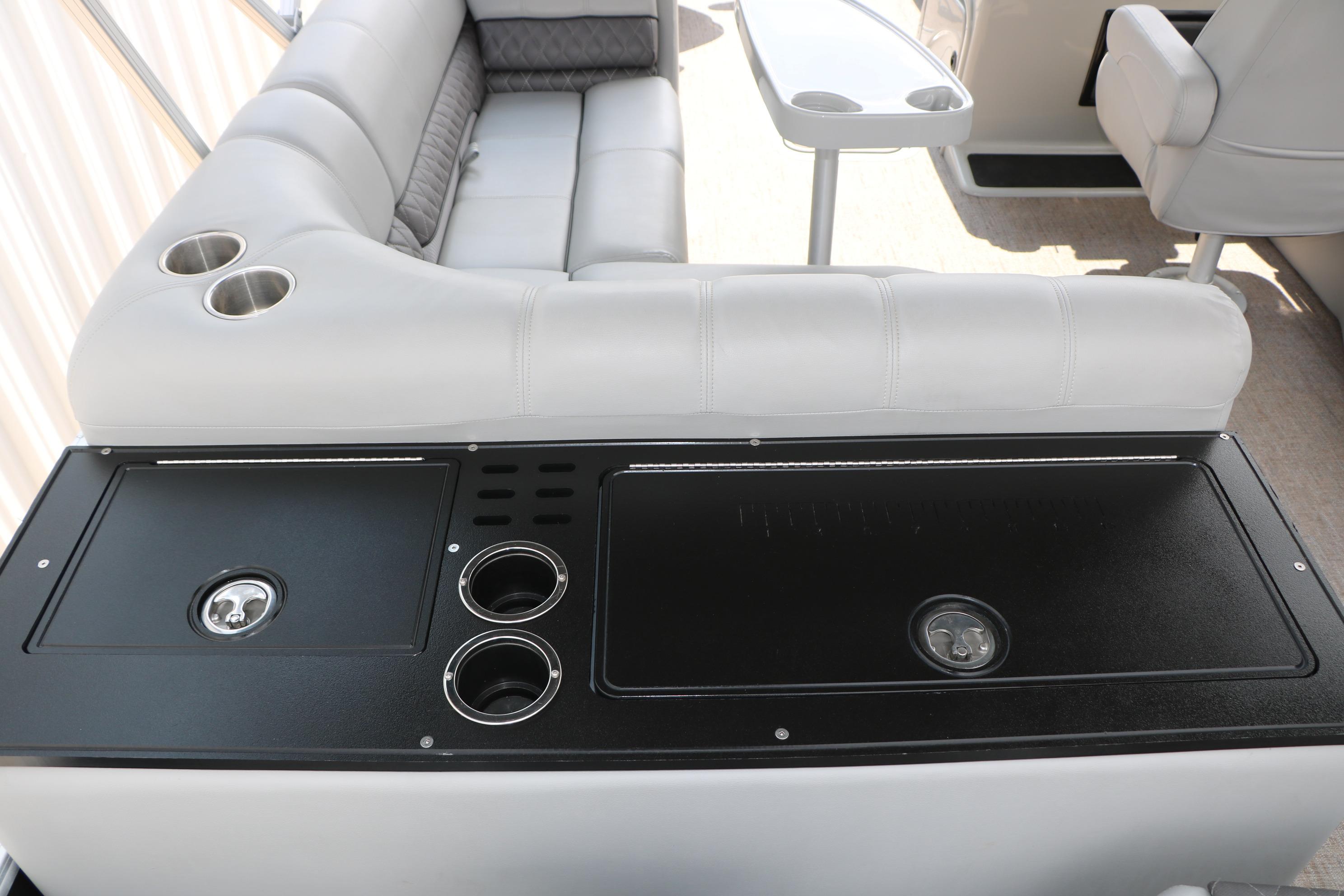 Interior of 2021 Ranger 223FC boat with seating and cup holders.