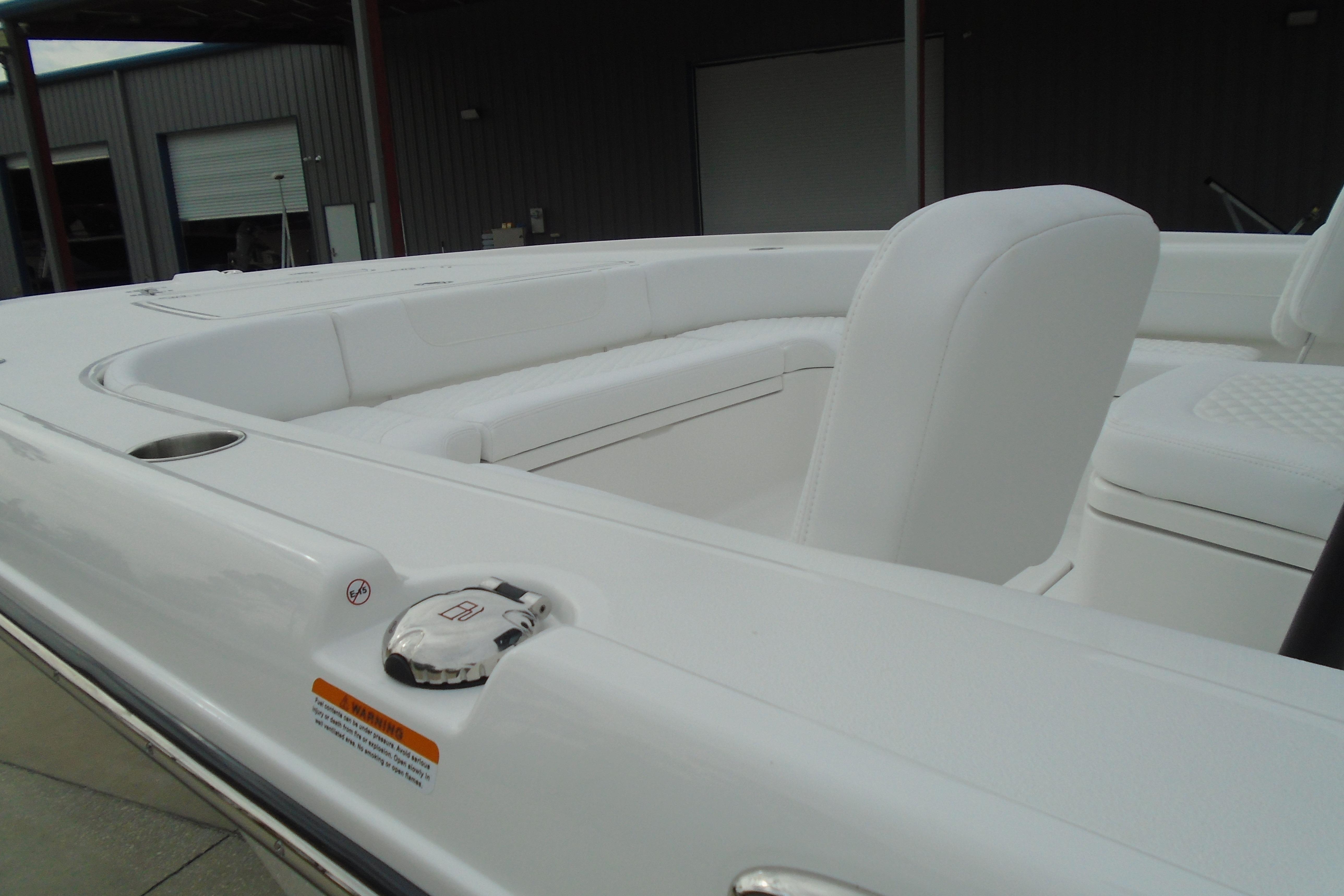 2026 Caymas 26 HB boat interior with white seating and sleek design.