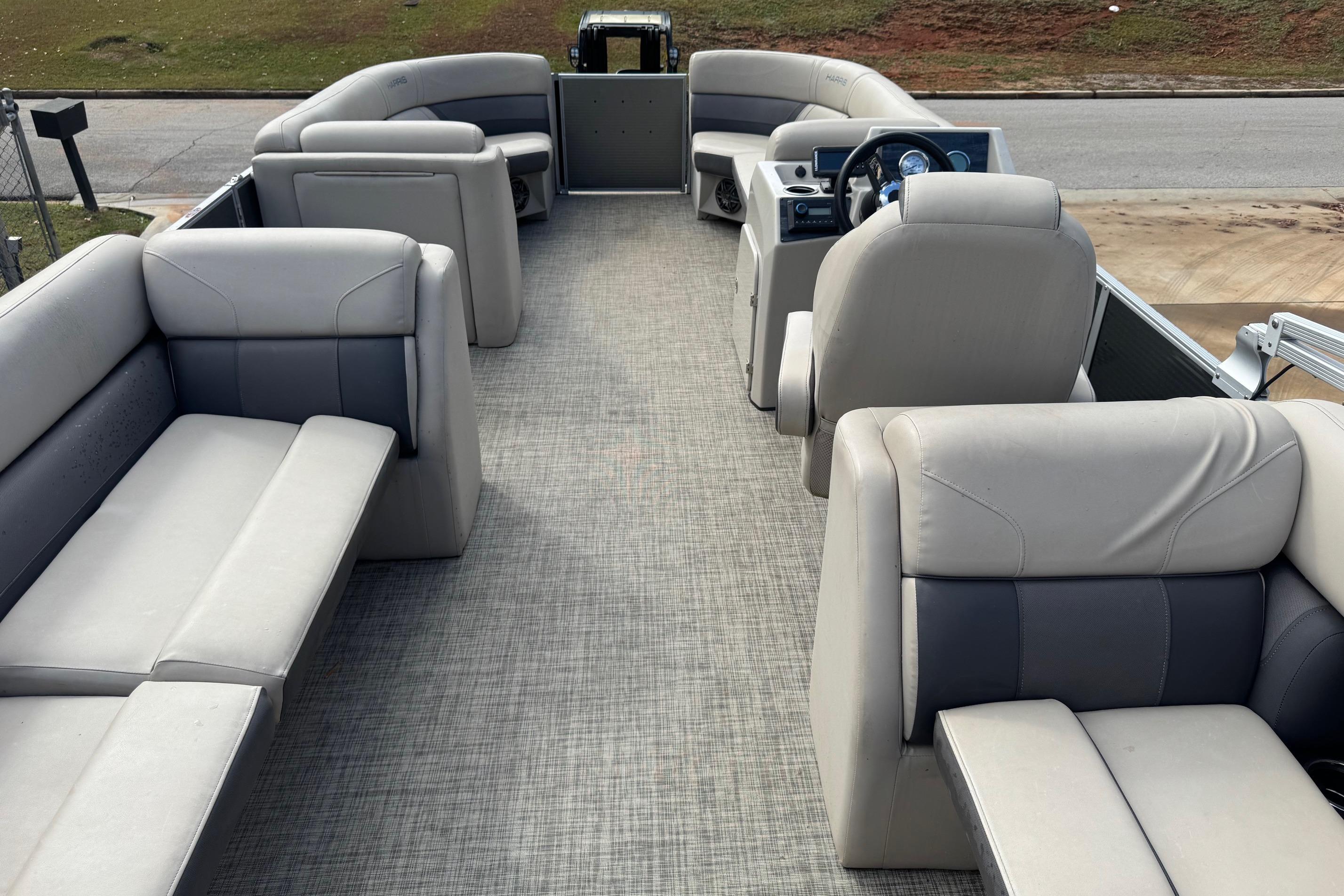 2023 Harris Cruiser 230 pontoon boat interior with spacious seating and modern design.