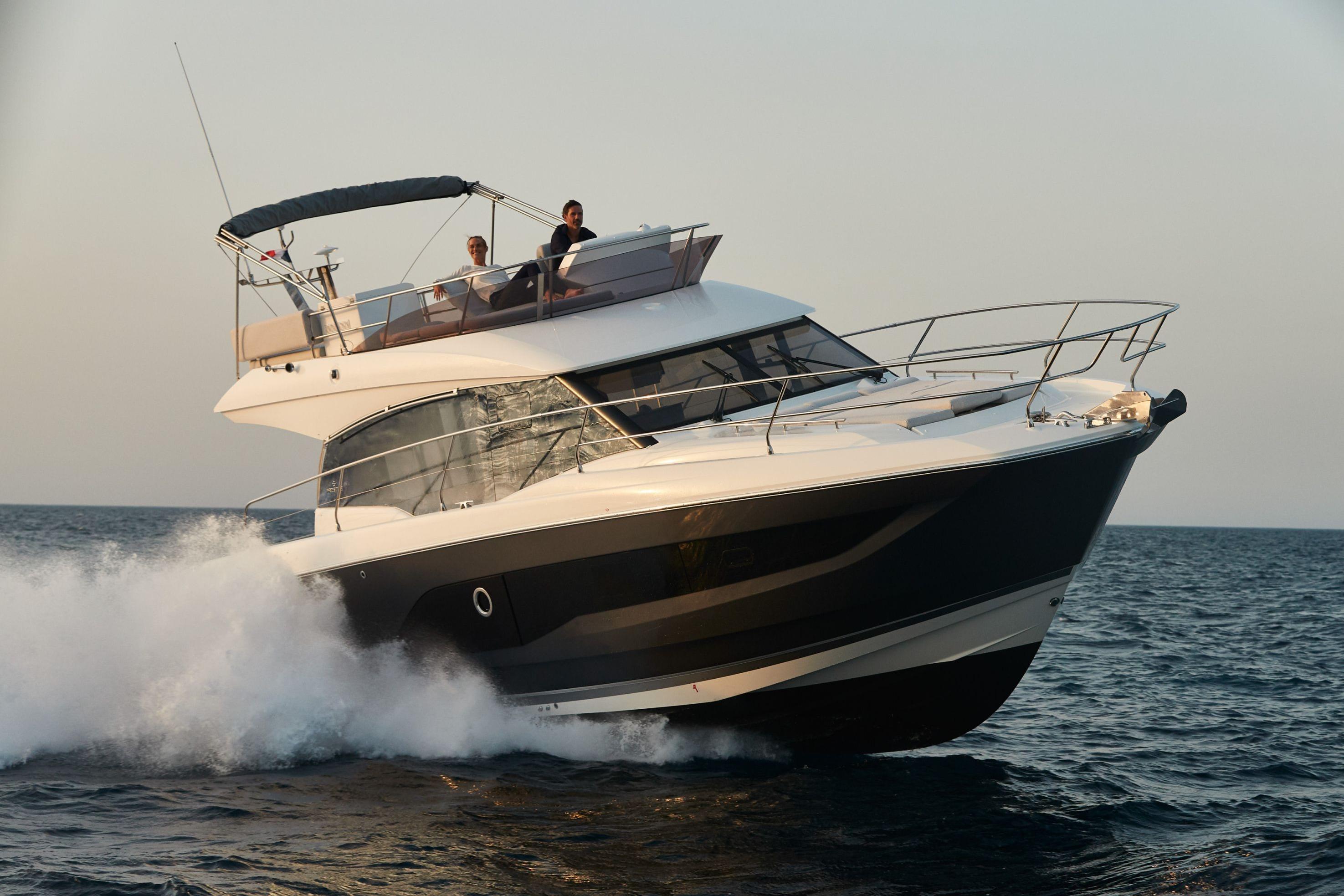2026 Prestige 420 yacht cruising on open sea, creating waves.