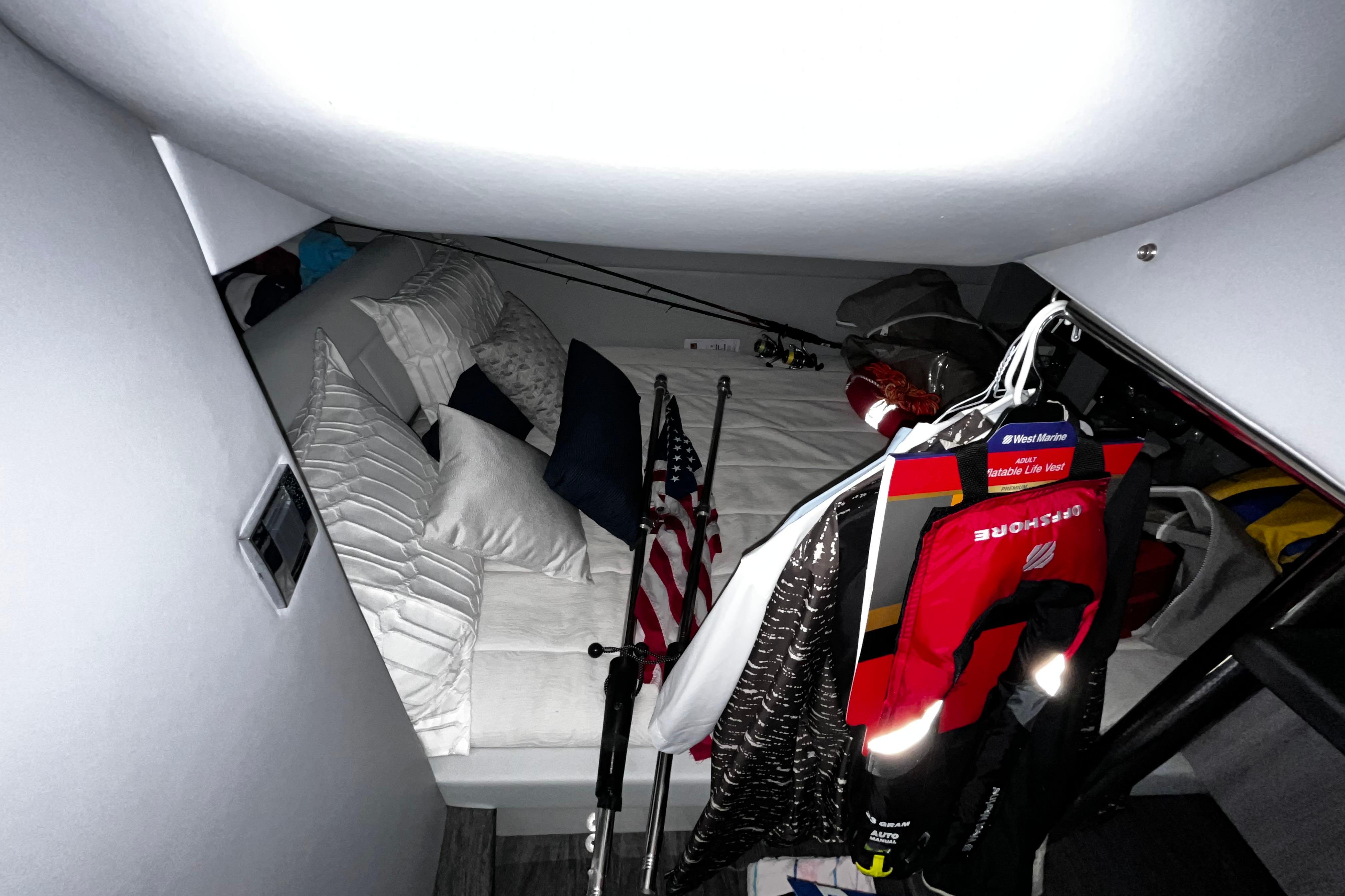 2023 Formula 380 Super Sport Crossover OB cabin with bed, pillows, and life vests.