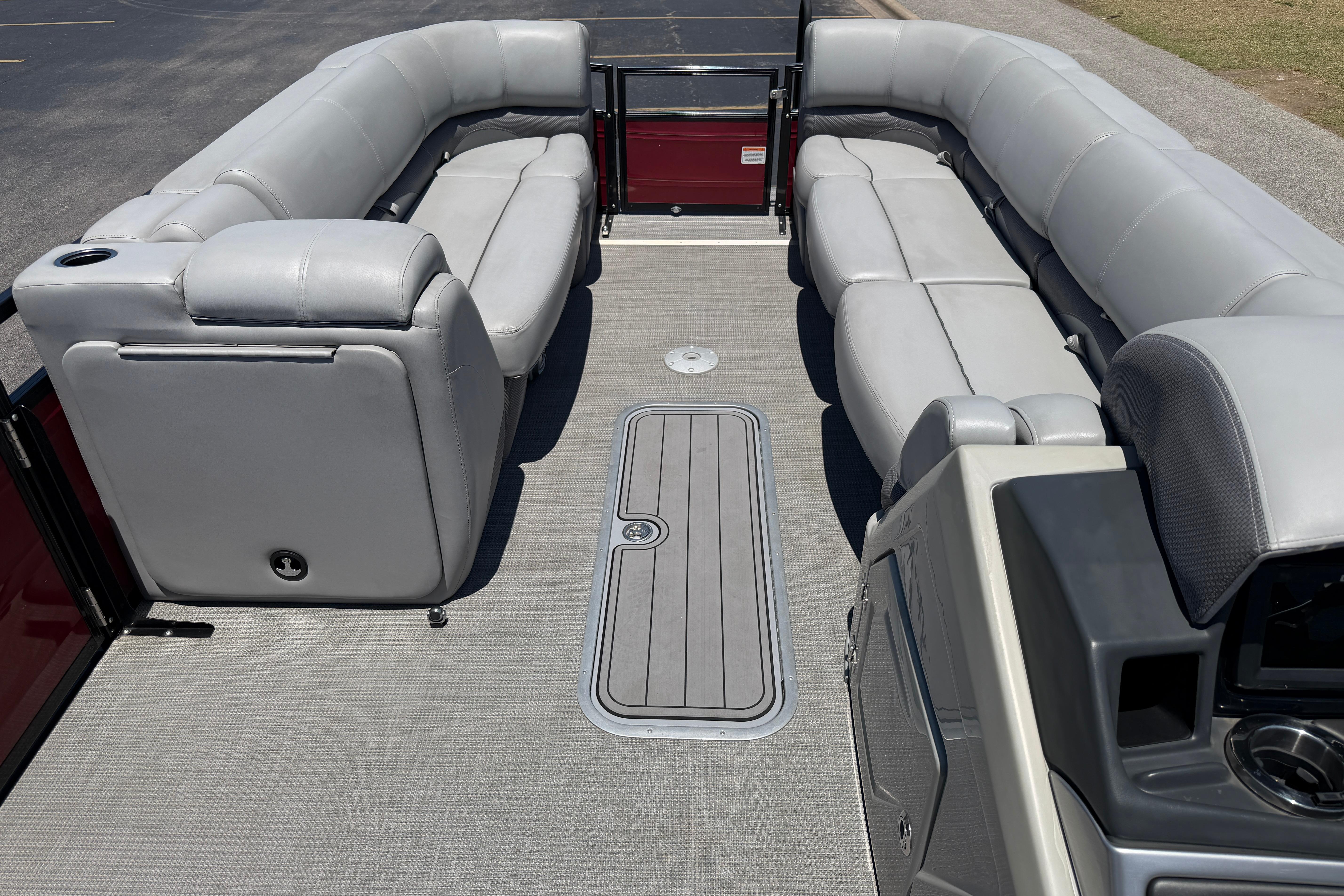 2024 Regency R250DL3 pontoon boat interior with gray seating and modern design.