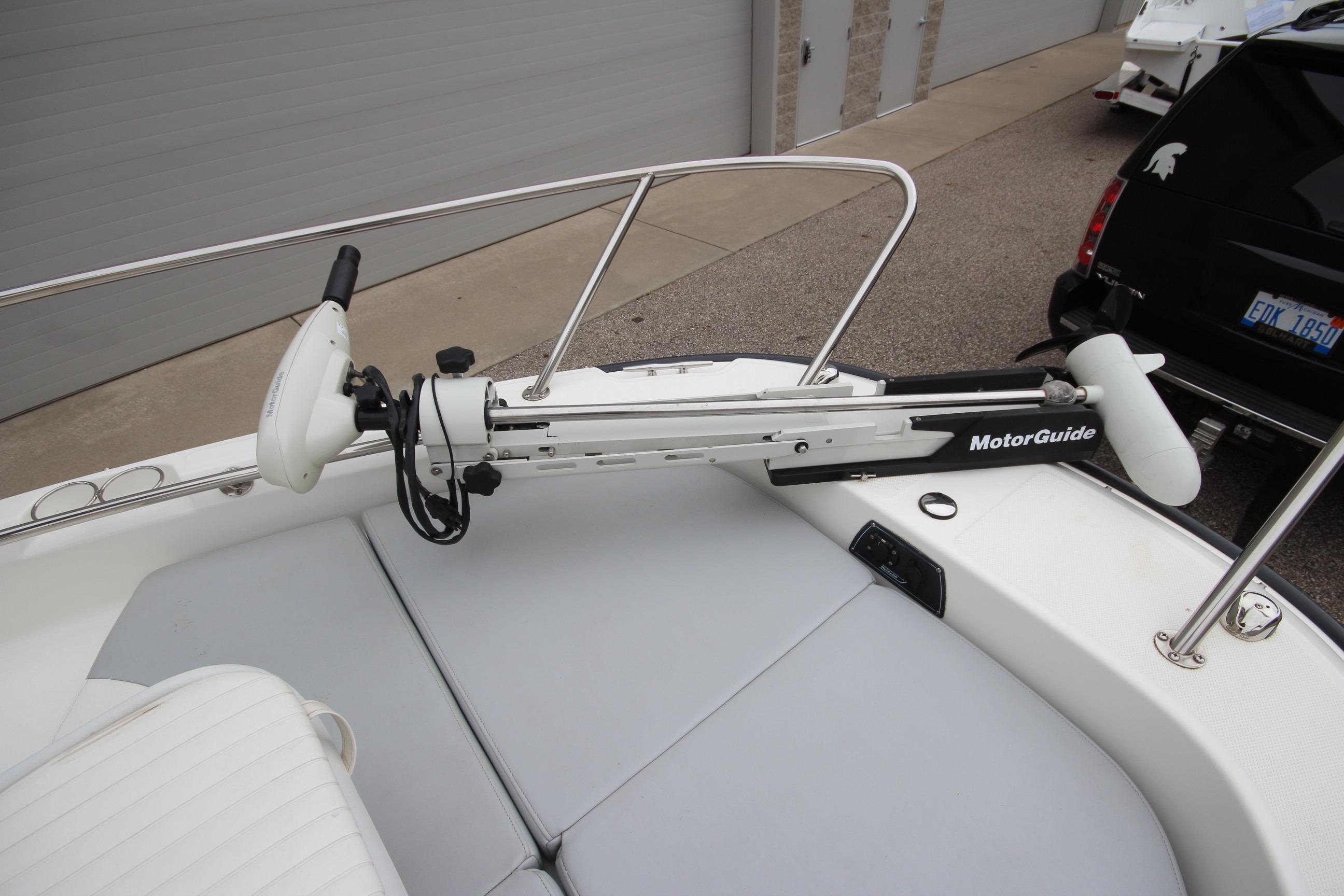 2014 Boston Whaler 210 Dauntless boat with MotorGuide trolling motor on deck.