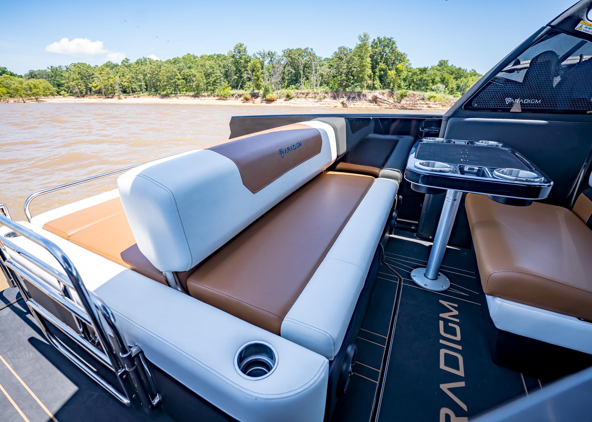 Luxurious Paradigm 236 boat interior with comfortable seating and table, 2025 model.