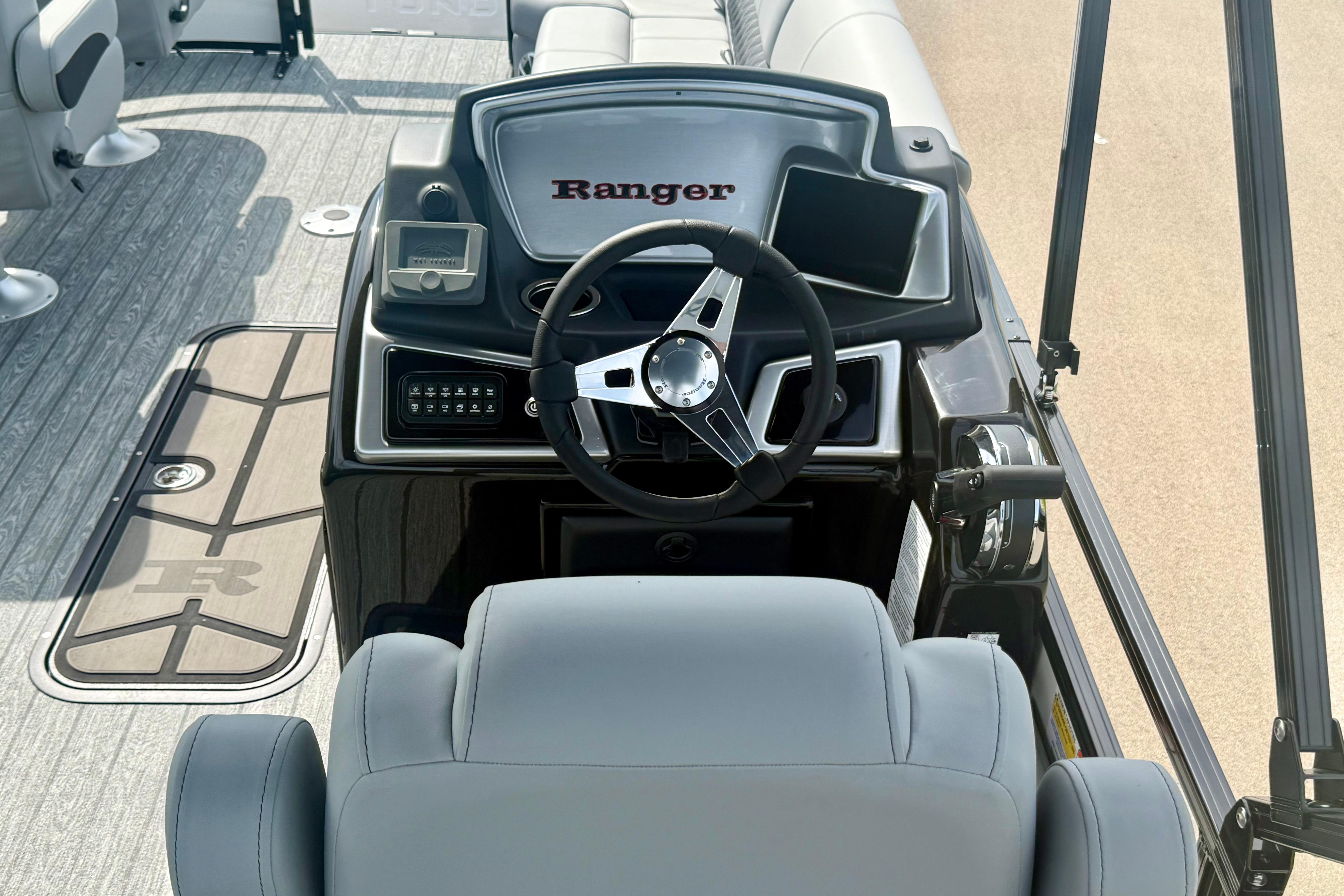 2026 Ranger 223FC boat dashboard with steering wheel and control panel.