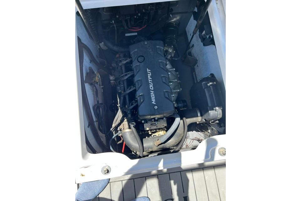 Engine compartment of 2019 Yamaha Boats 190 FSH Sport, featuring high output engine.