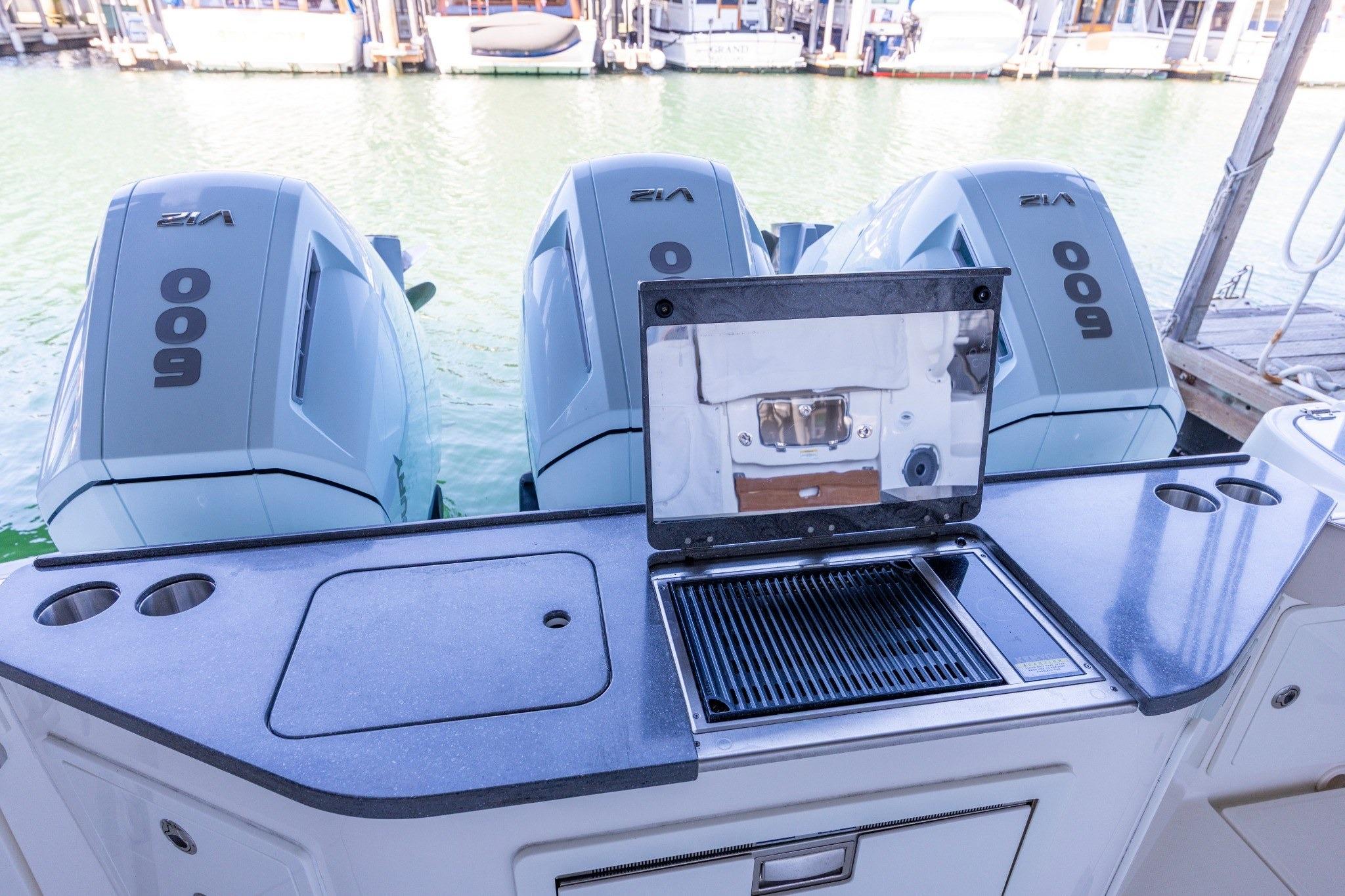 2023 Boston Whaler 405 Conquest with triple 600hp engines and onboard grill.