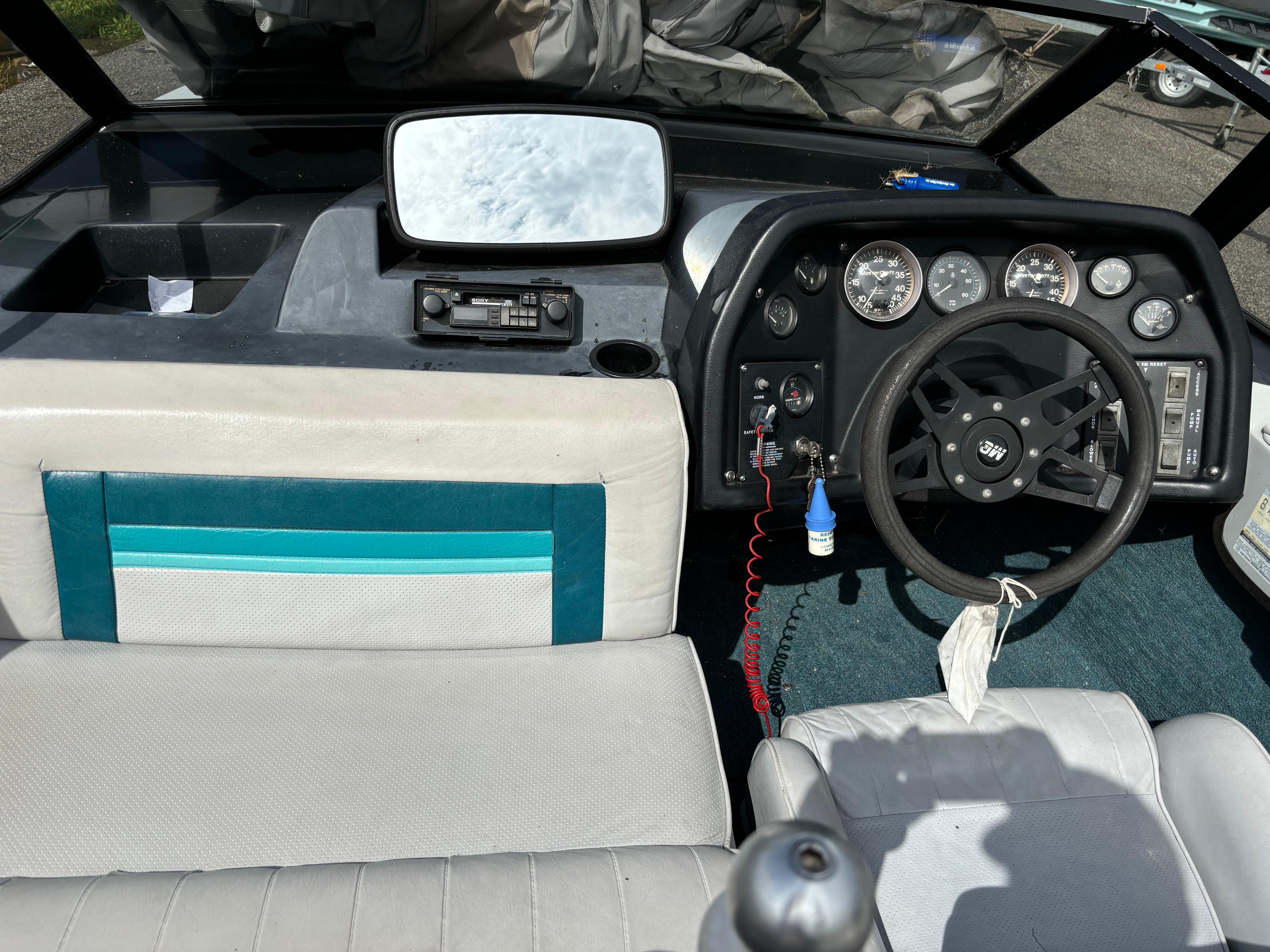 1989 MasterCraft ProStar 190 boat interior with steering wheel and dashboard controls.