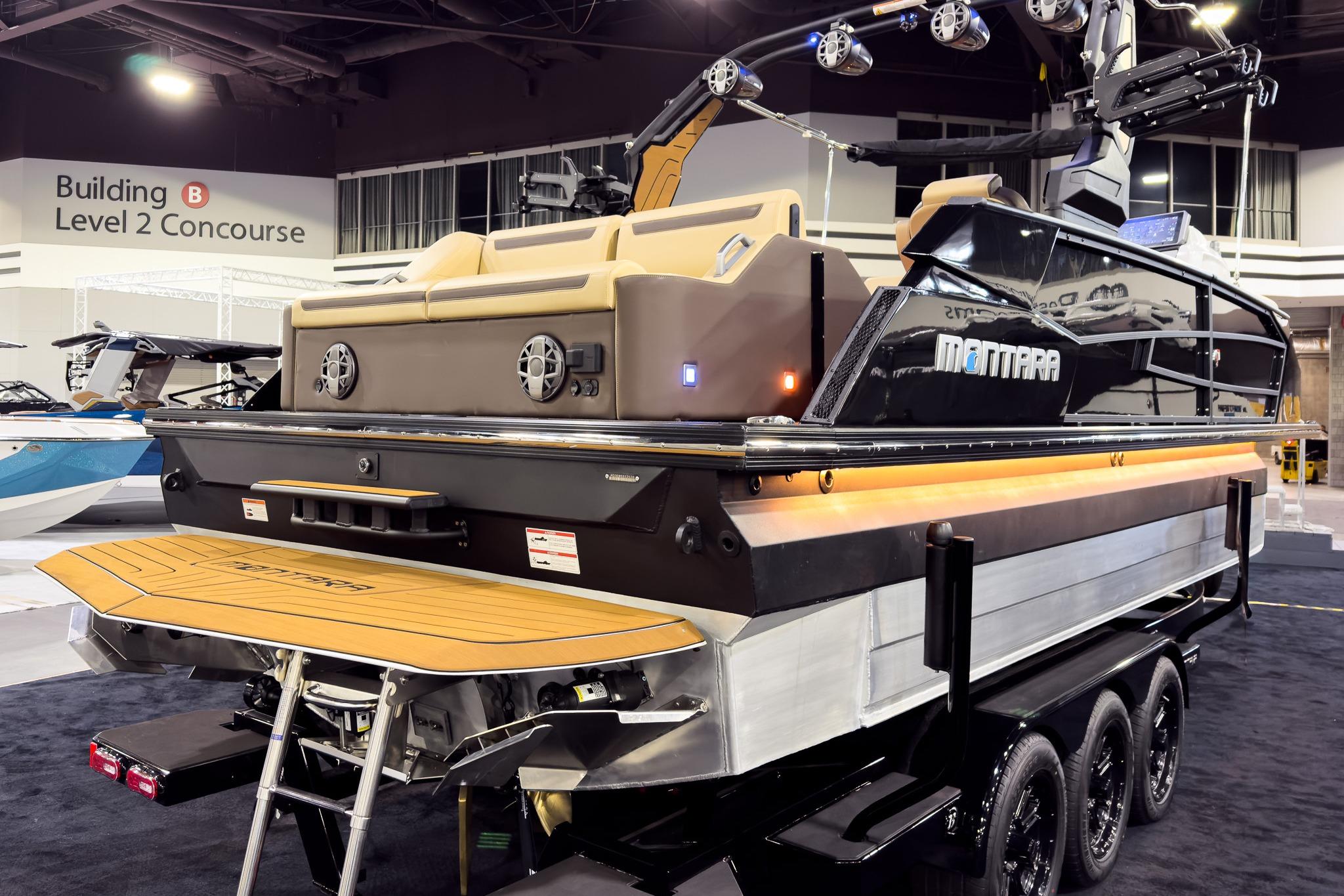 2026 Montara Surf Boss EVO - SLDH 25' boat displayed indoors on a trailer.