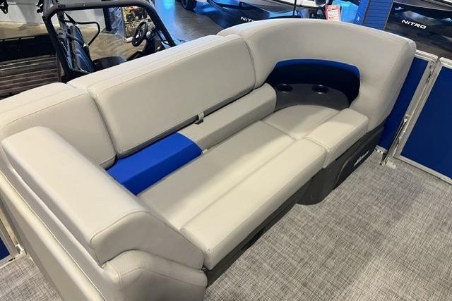 2026 Sun Tracker Party Barge 20 DLX pontoon boat seating, featuring gray and blue upholstery.