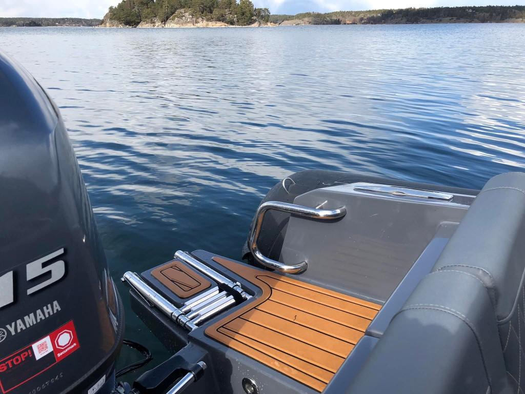 2024 Northstar Orion 6 boat with Yamaha engine on a serene lake.