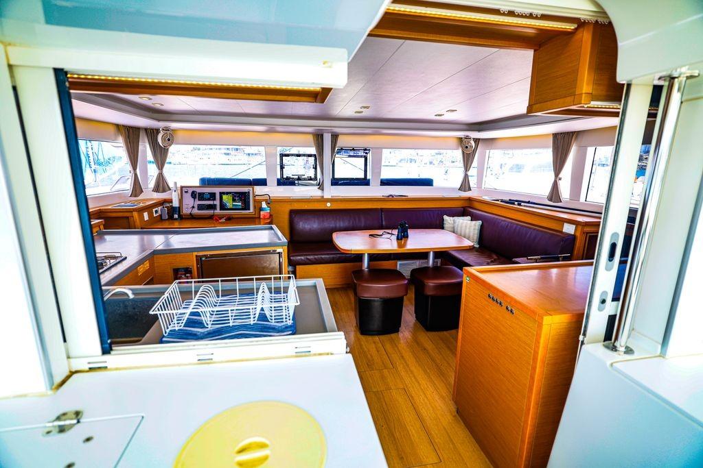 Interior of 2017 Lagoon 450 F yacht, featuring a spacious dining area and modern kitchen.