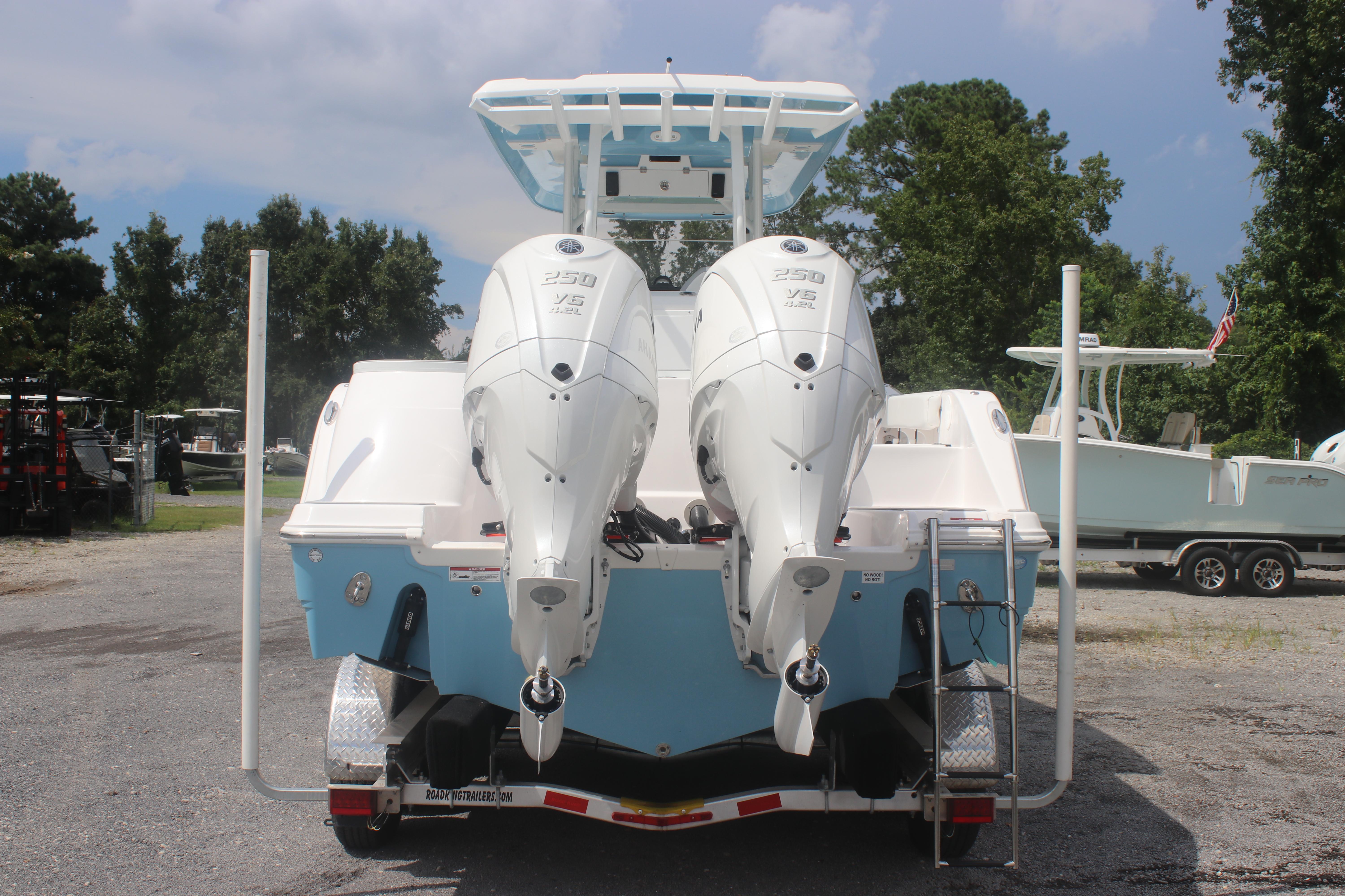 2026 Sea Fox 288 Commander boat with dual outboard engines on a trailer.
