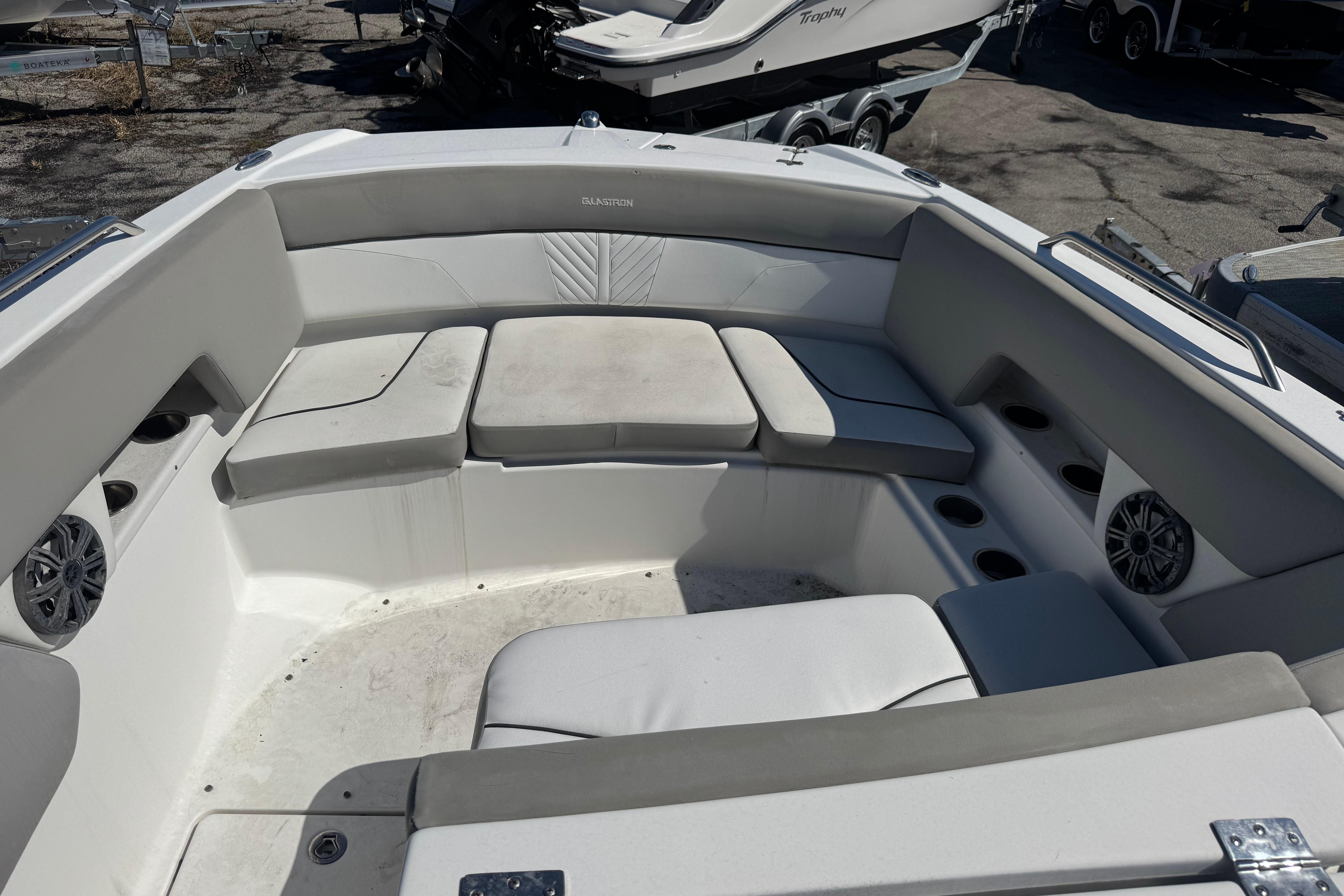 2020 Glastron GTD 240 boat interior with cushioned seating and cup holders.