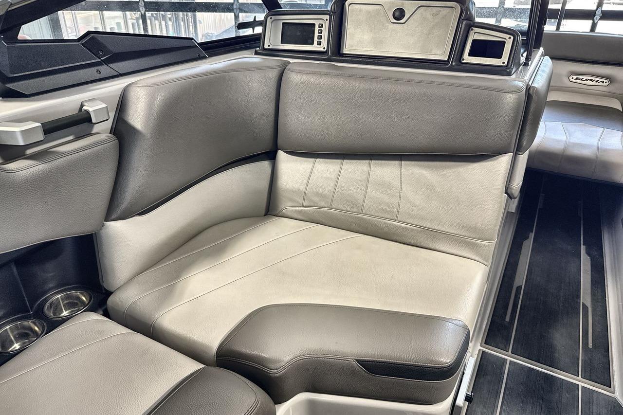 Luxurious interior seating of 2021 Supra SE 550 boat with sleek design and premium materials.