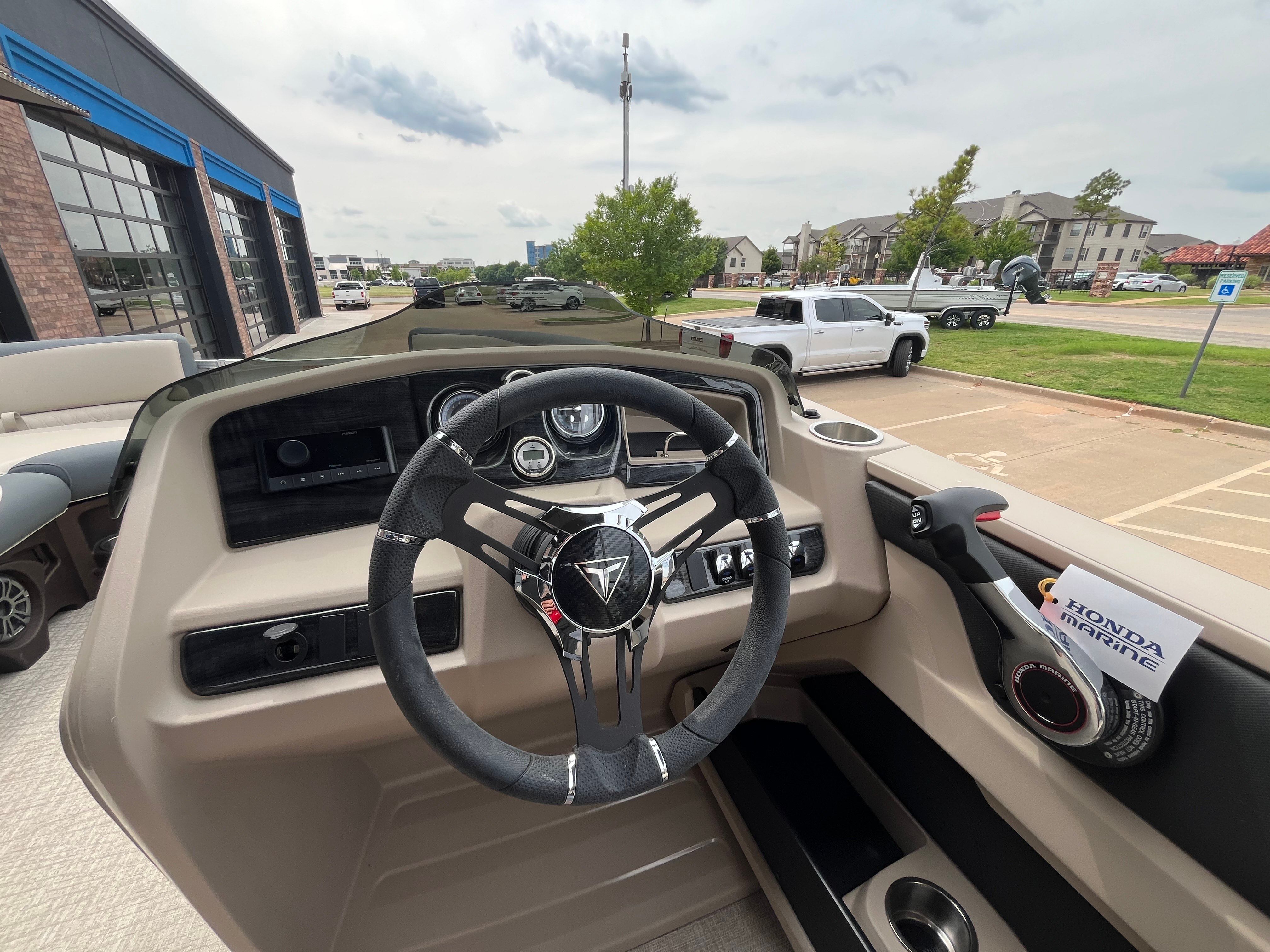 Interior view of 2025 Tahoe LTZ QL boat with steering wheel.