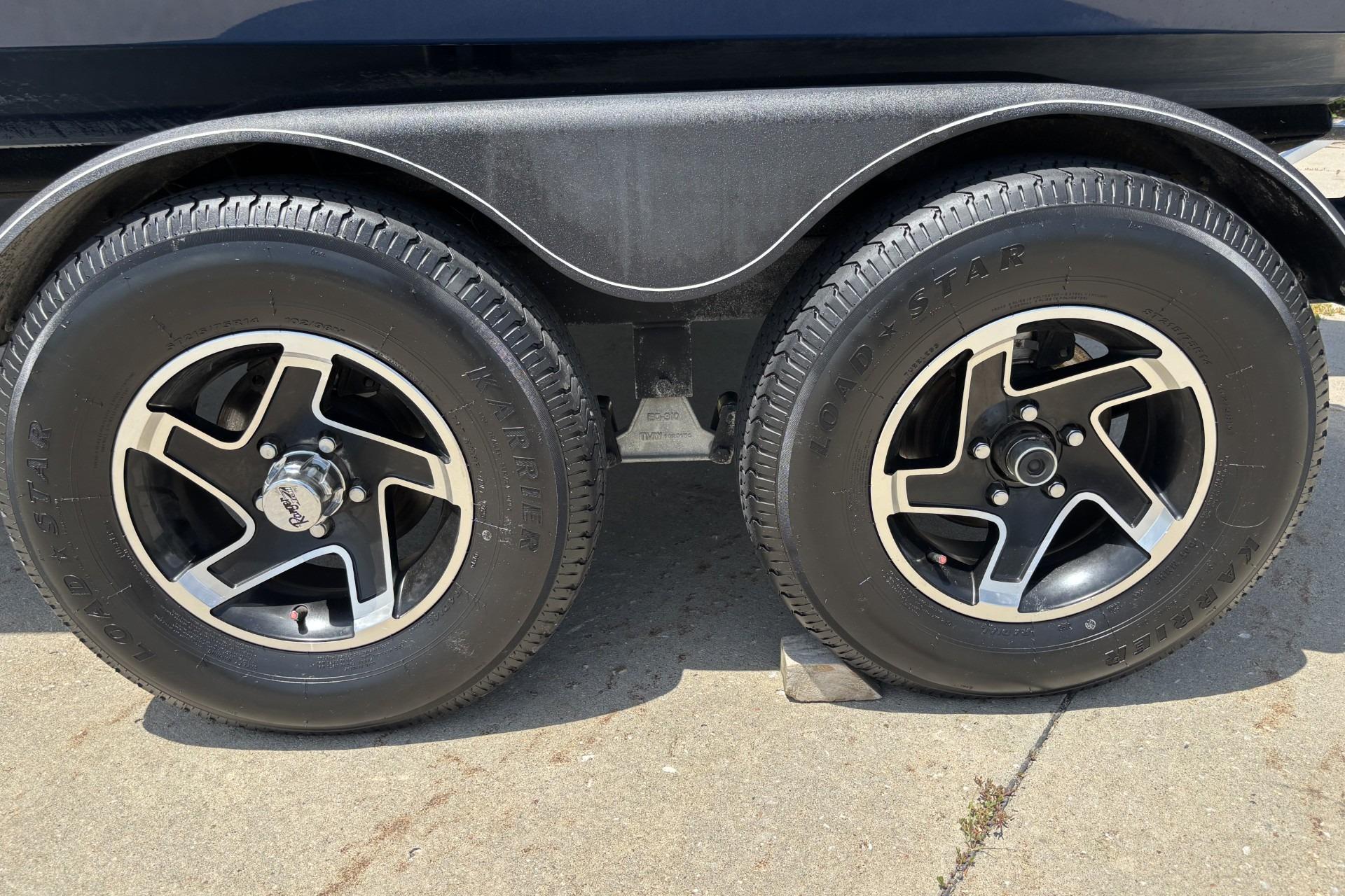 2021 Ranger VX1788 WT trailer wheels on concrete pavement.