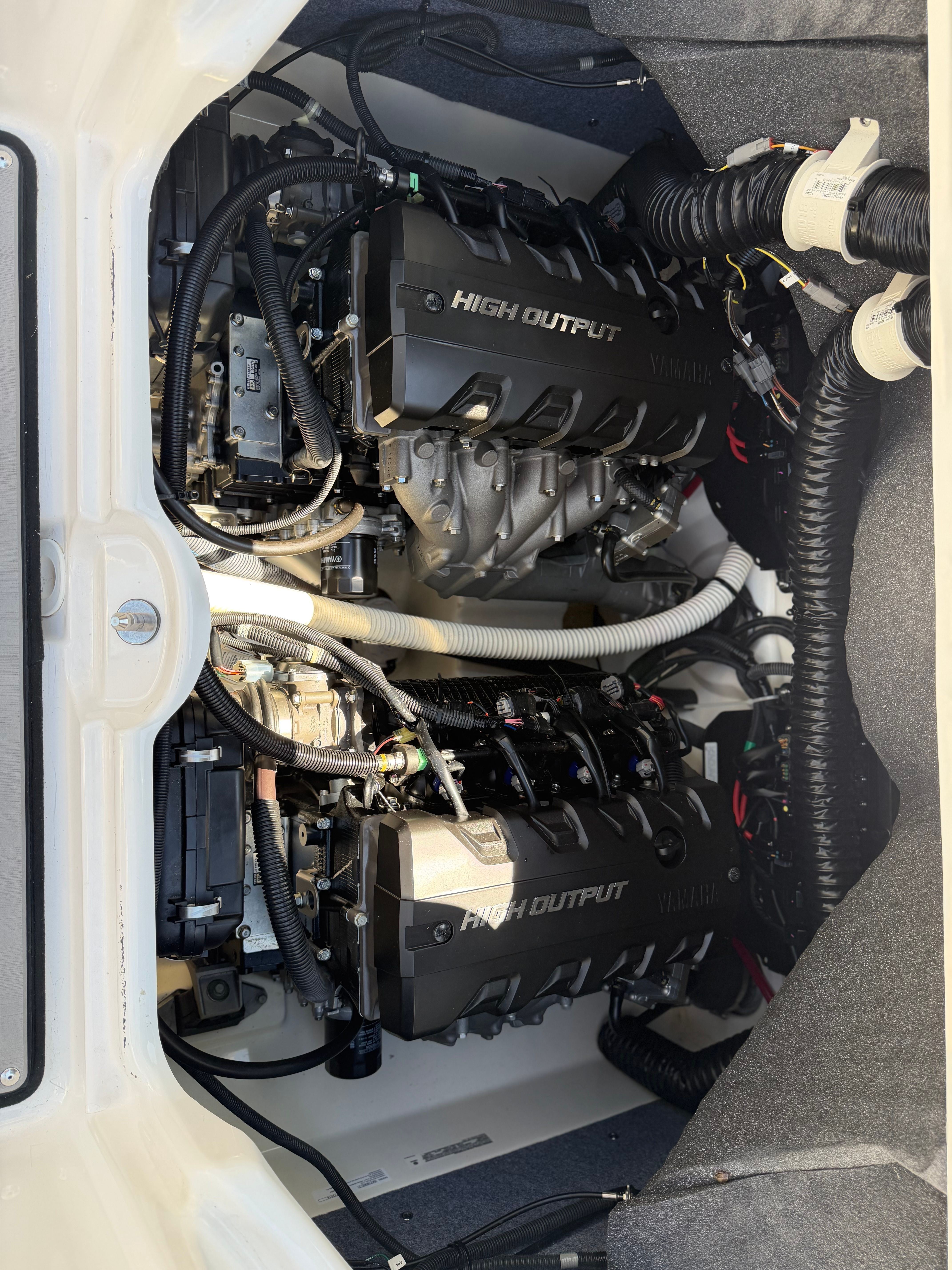 Engine compartment of a 2018 Yamaha 242 Limited S with dual high-output engines.