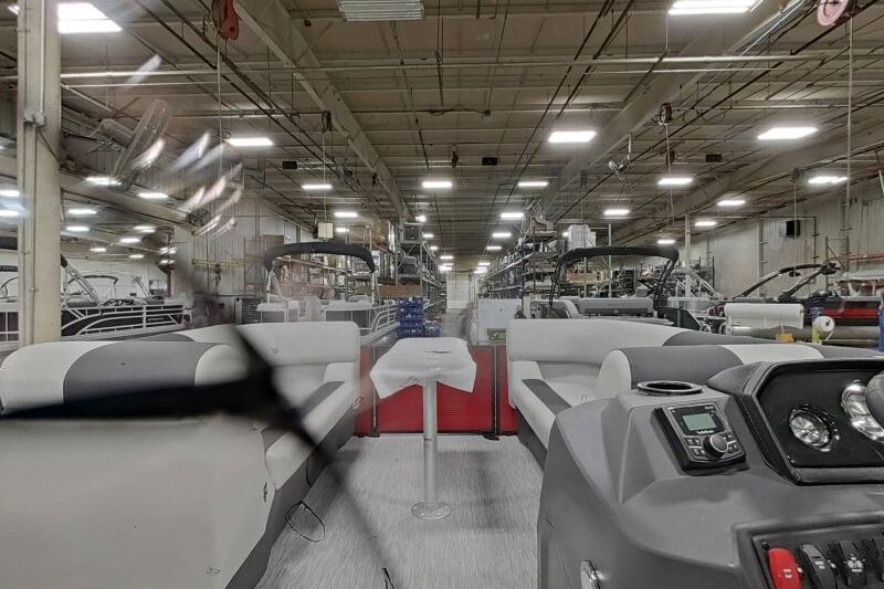 Interior view of a 2026 Bennington 22 SSRSF boat in a factory setting.