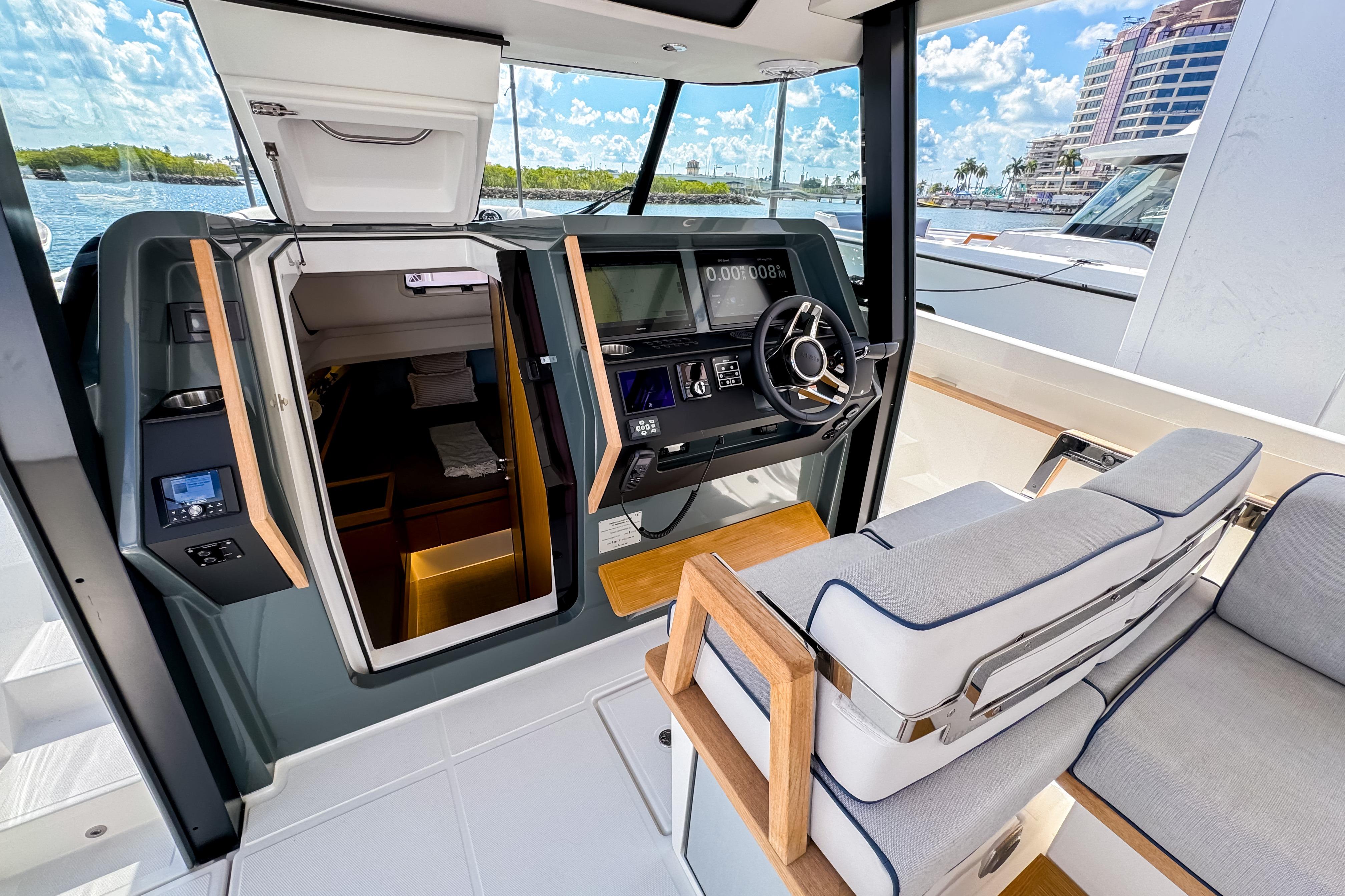Interior view of 2025 Aiata Wayfinder 38 Open yacht cockpit with modern controls.