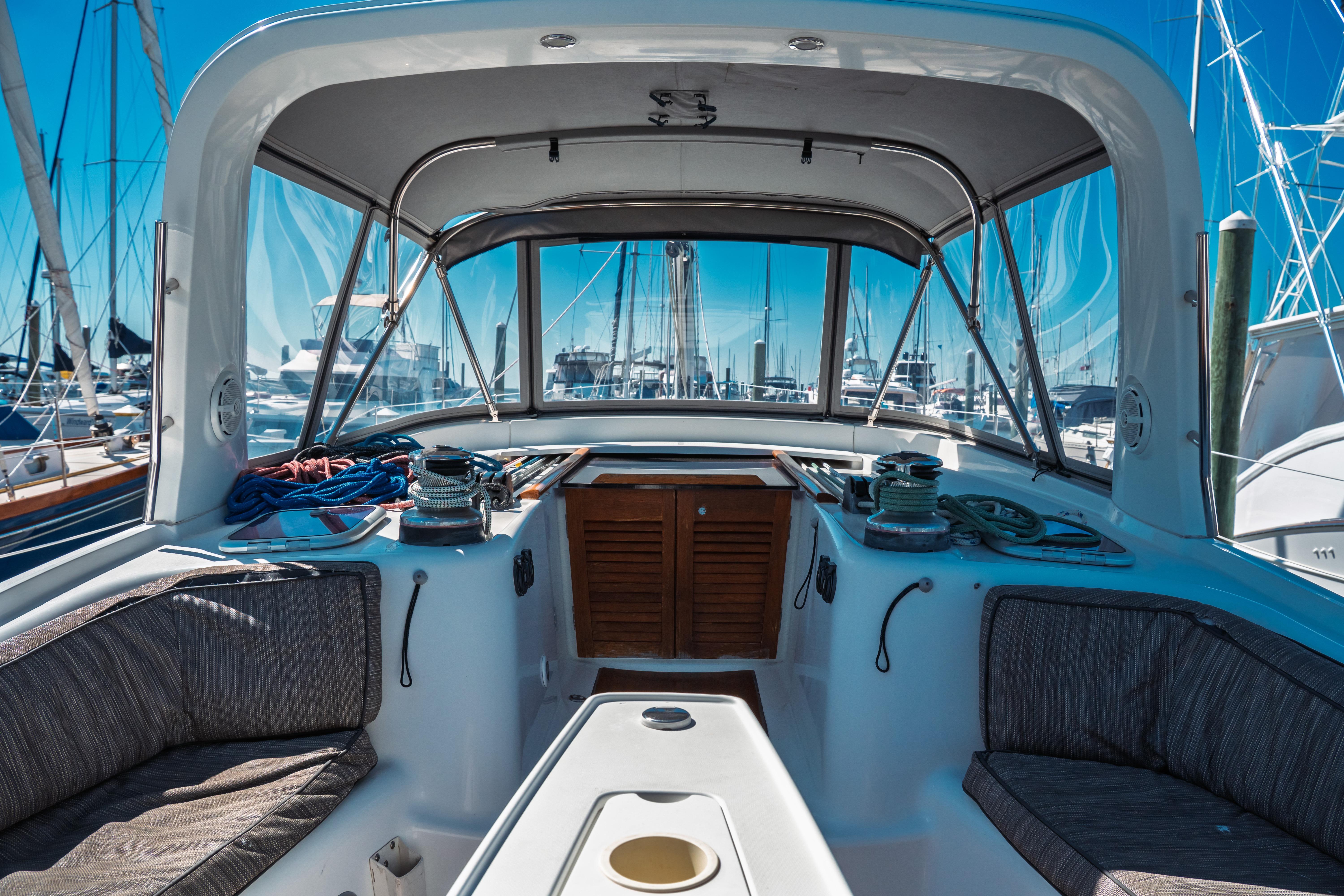 Cockpit view of 2011 Beneteau Oceanis 50 sailboat in marina setting.