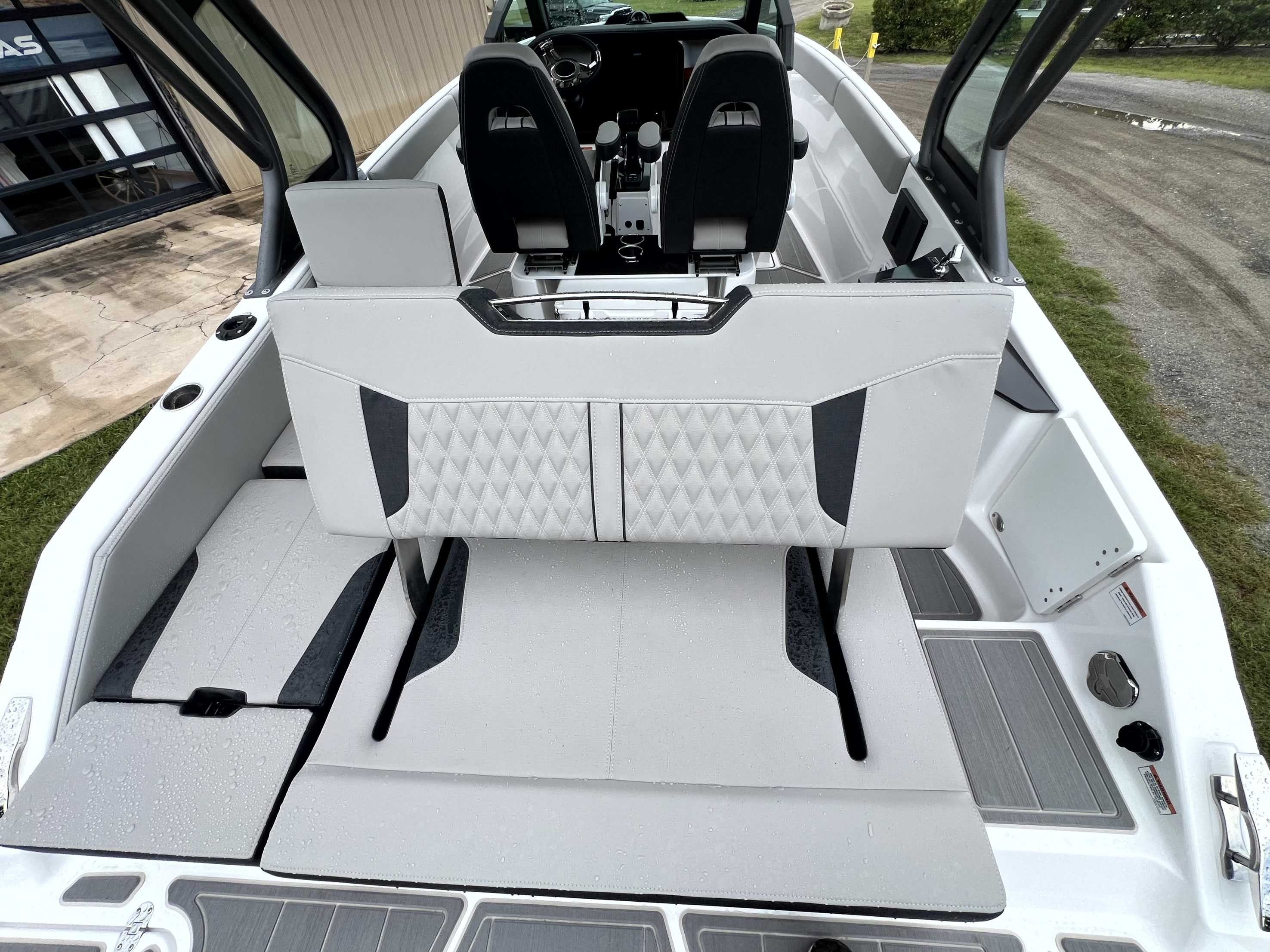 The image shows the interior of a 2026 Monterey Elite 25 boat with modern seating.