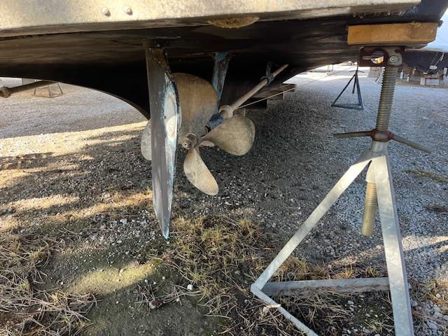 1977 Hatteras 43 Double Cabin boat propeller and hull on dry dock.