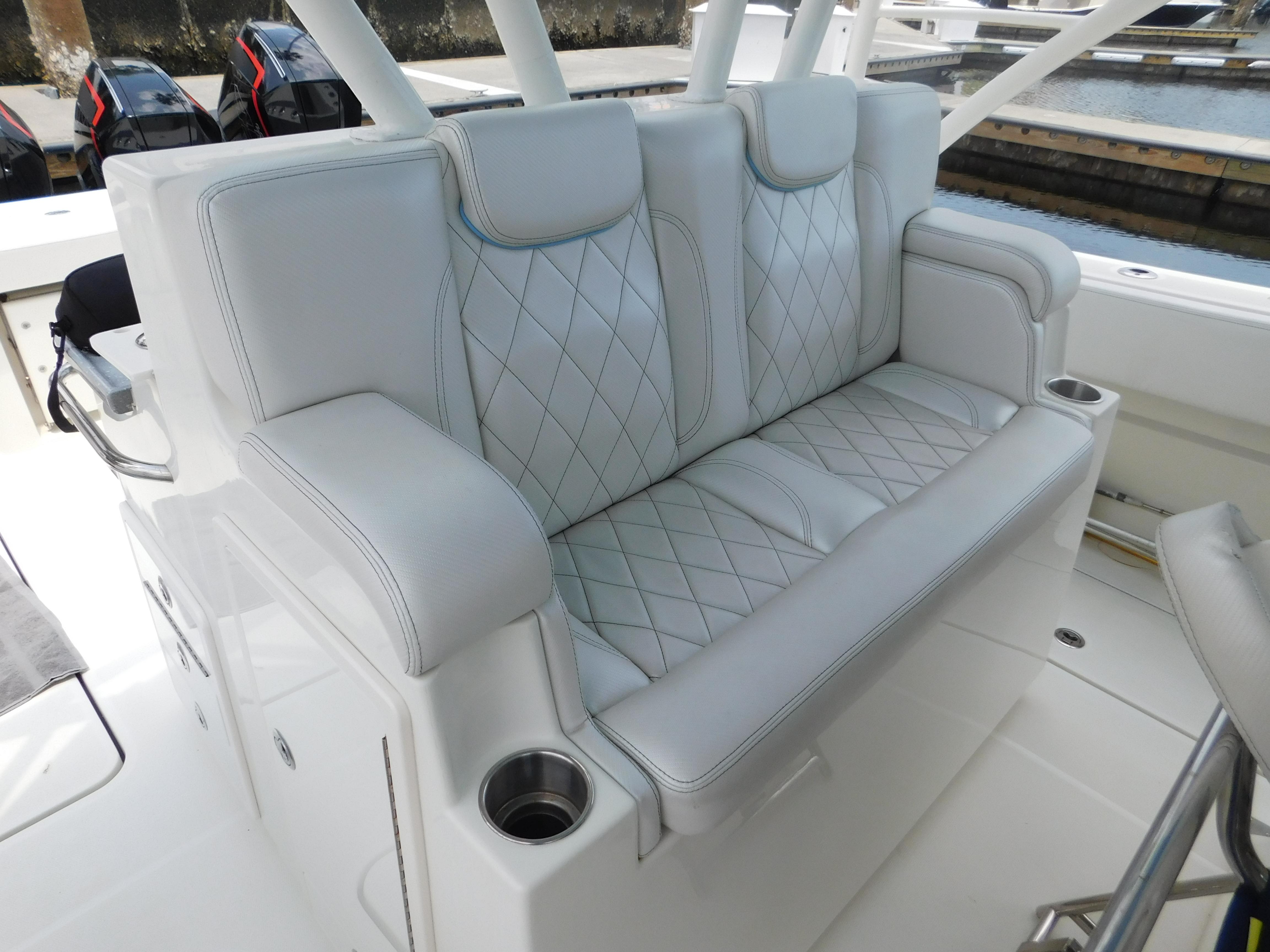 Luxurious seating on a 2013 Hydra-Sports 4200 Siesta boat with diamond-stitched upholstery.