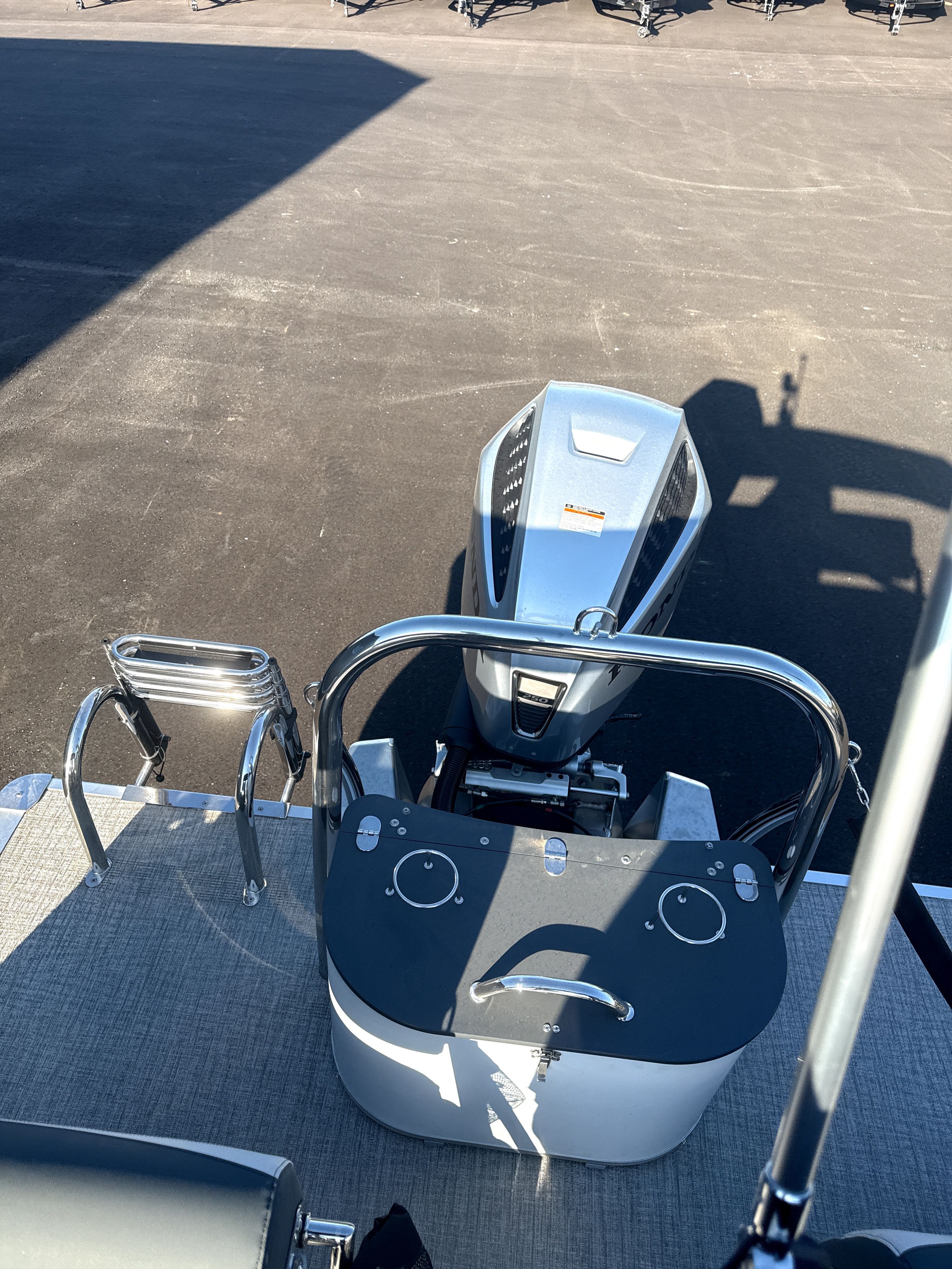 2026 Tahoe LTZ Quad Lounge Shift boat with engine view.