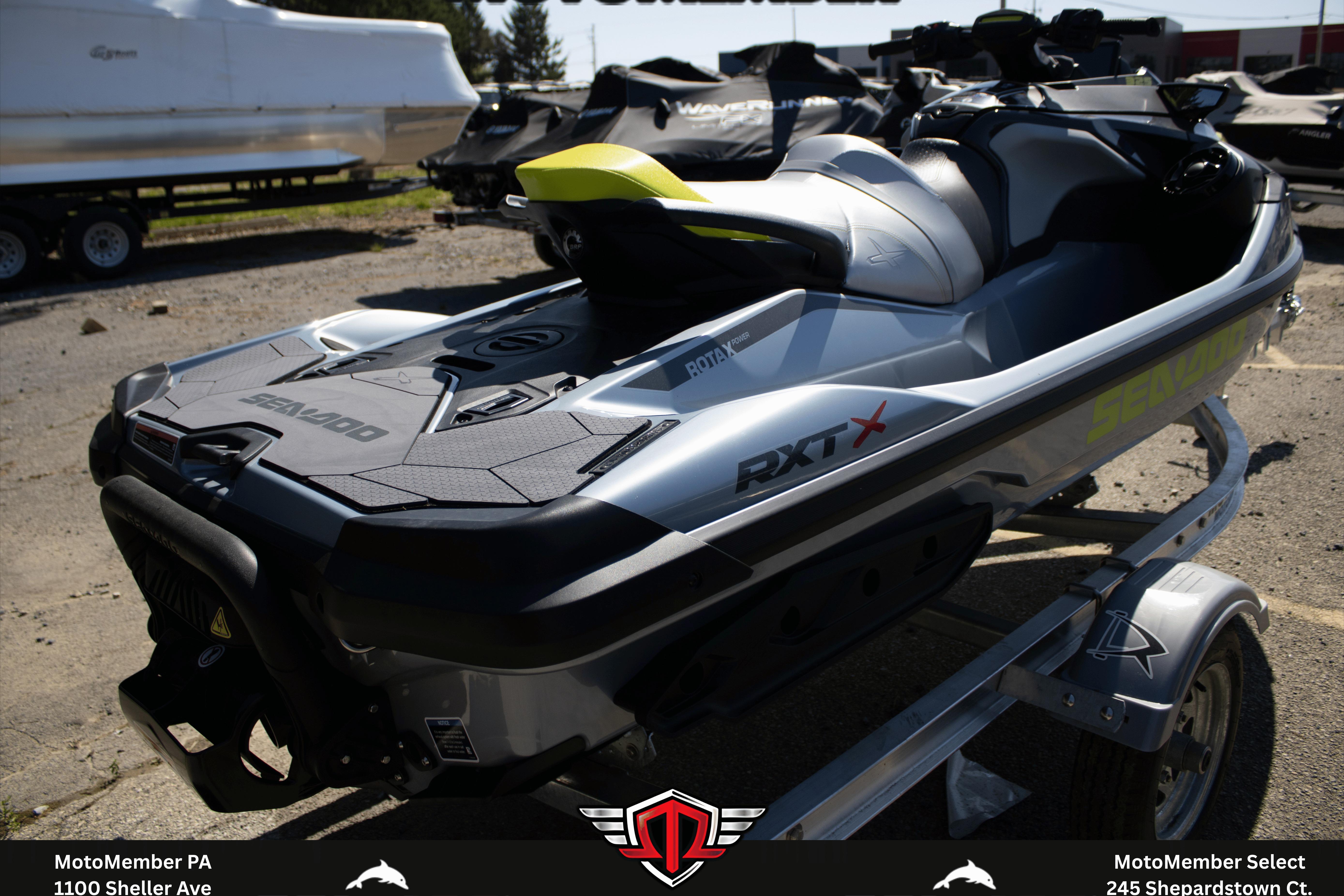 2026 Sea-Doo RXT-X 325 jet ski on trailer, parked outdoors.