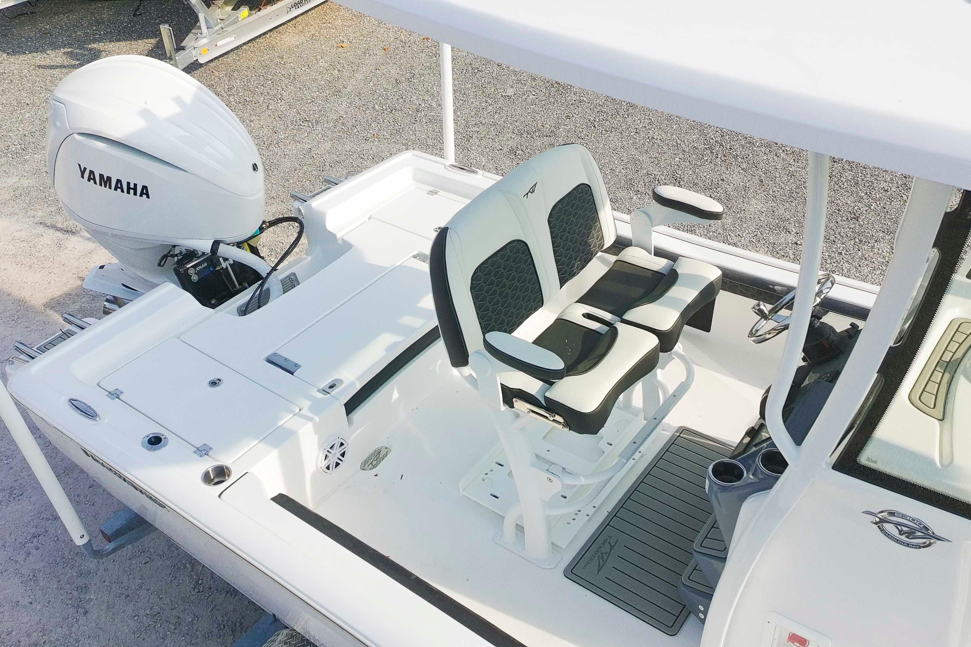 2026 Tidewater 2300 Carolina Bay boat interior with Yamaha engine and dual seating.