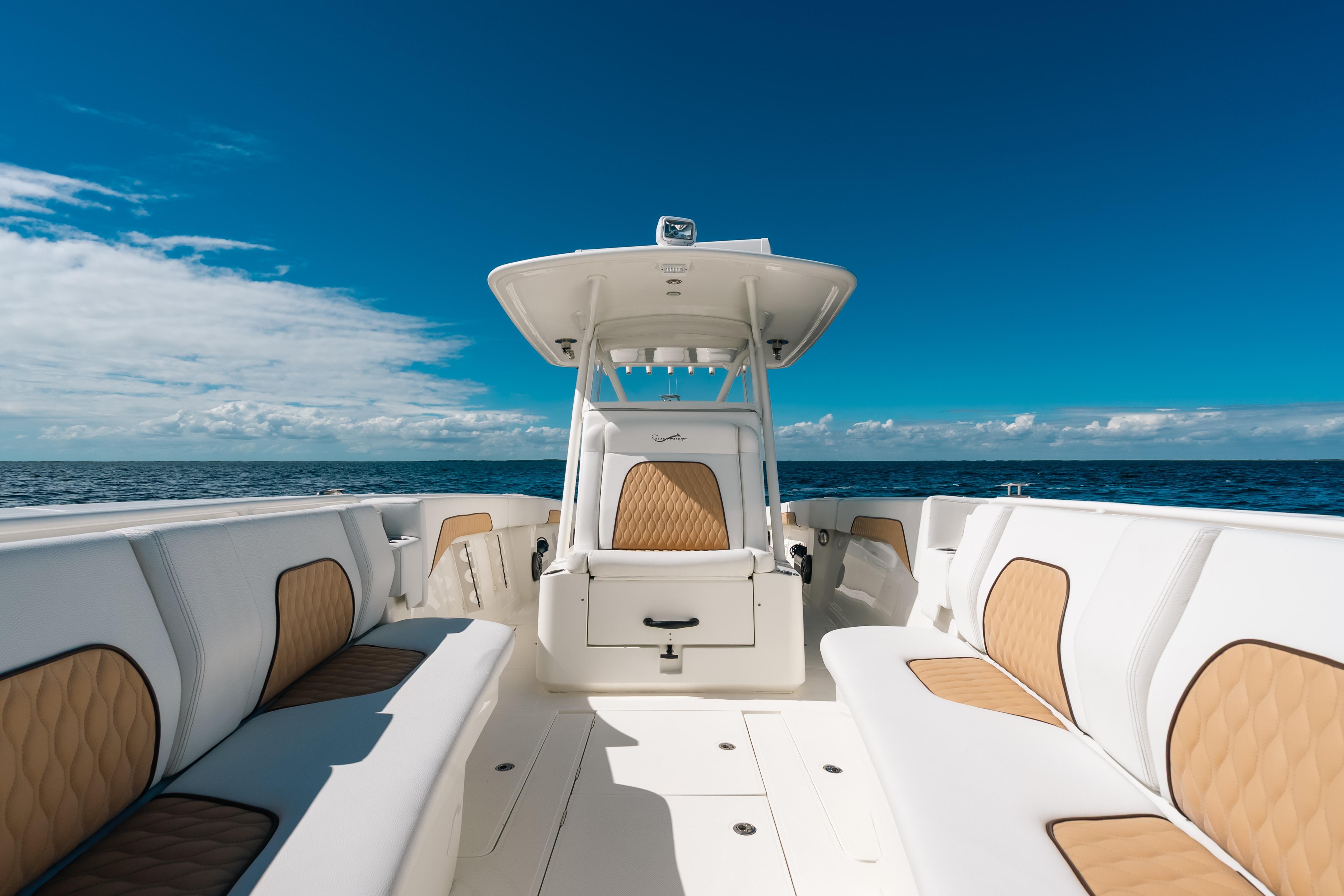 2021 Blackwater 36 Sport boat interior with white and tan seating, ocean view.