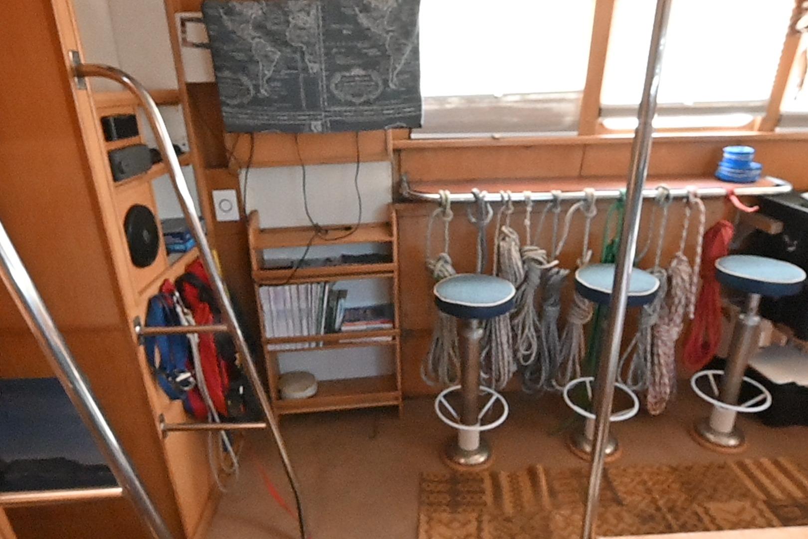 Interior of a 2015 Boden Schooner with nautical ropes and stools.