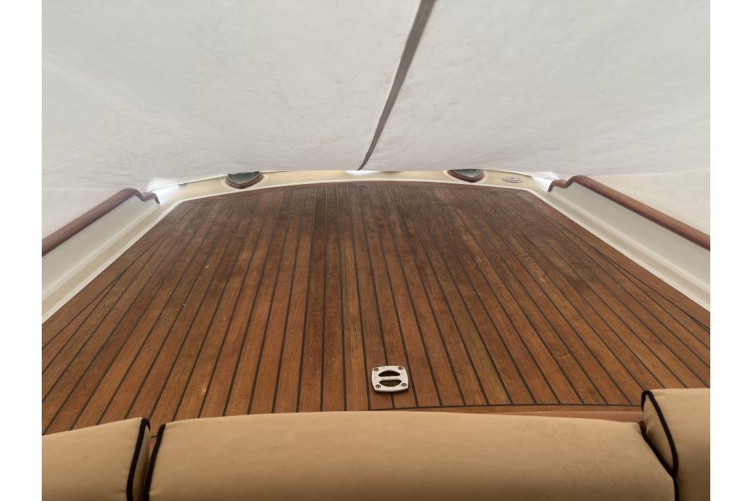 Teak deck of 2004 RB DERELI Daytripper 40 yacht, featuring elegant wood finish.