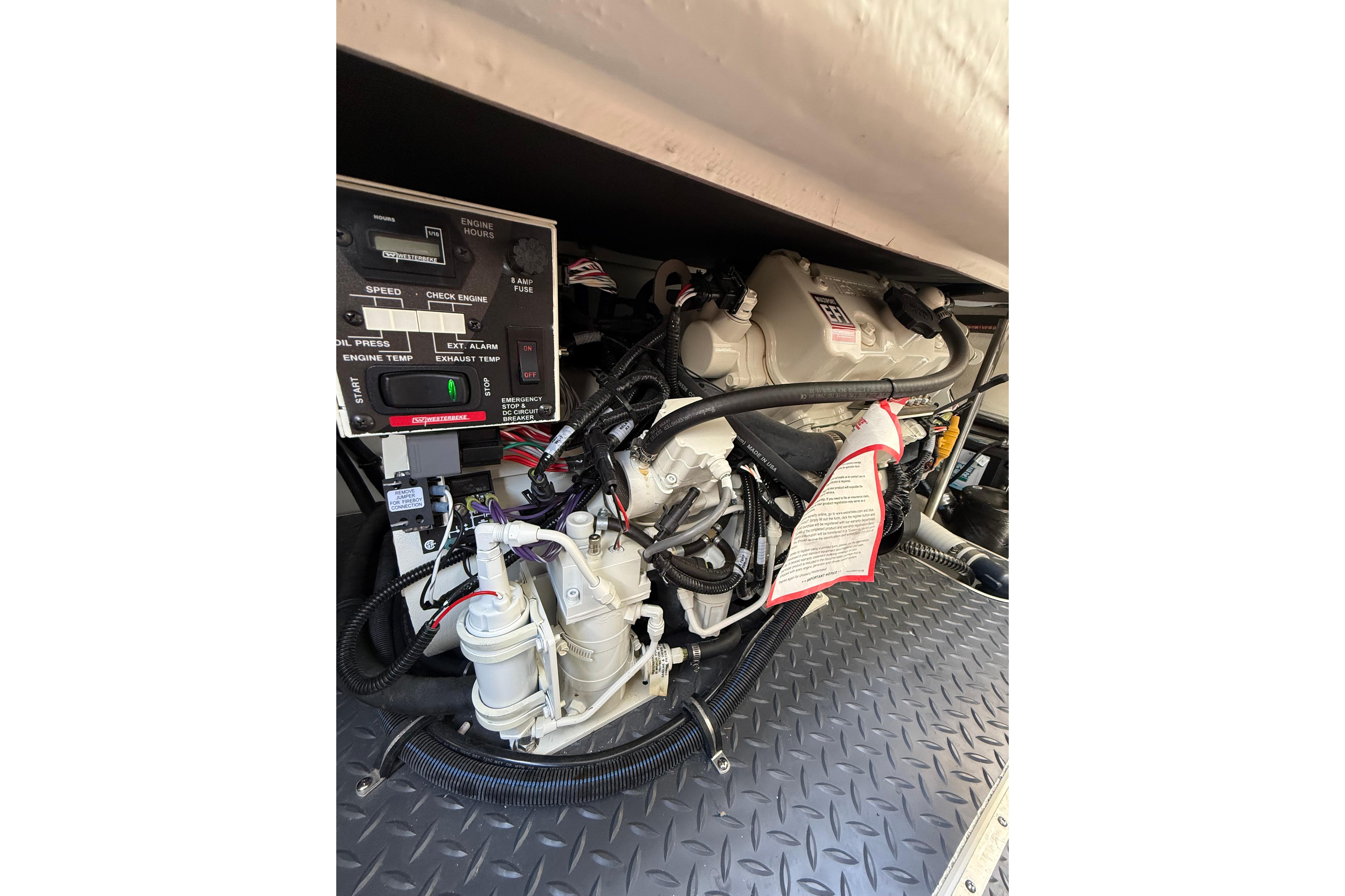 Engine compartment of a 2021 Formula 350 Sun Sport boat, showcasing detailed components.