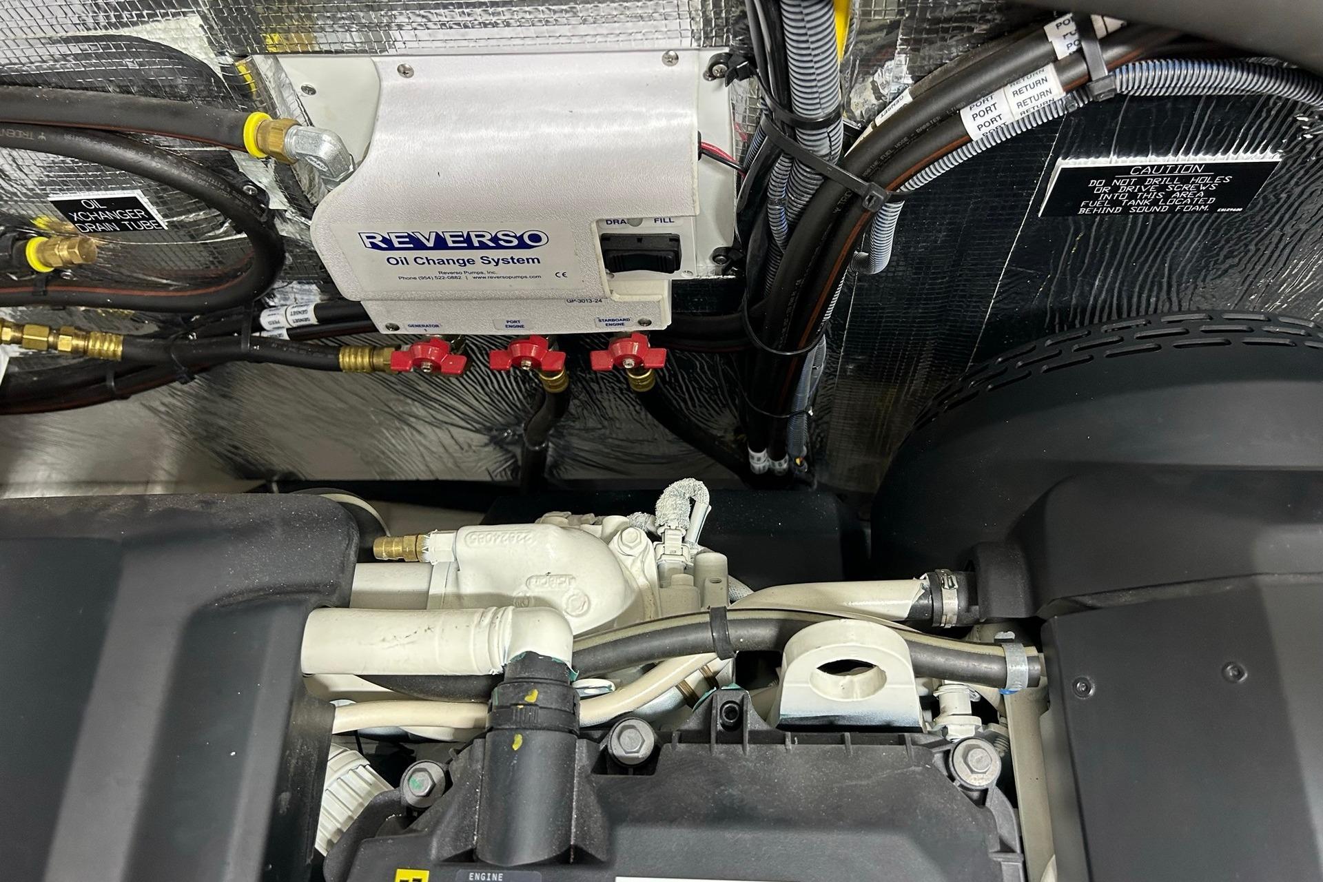 Engine room of 2021 Cruisers Yachts 50 Cantius with Reverso oil change system.