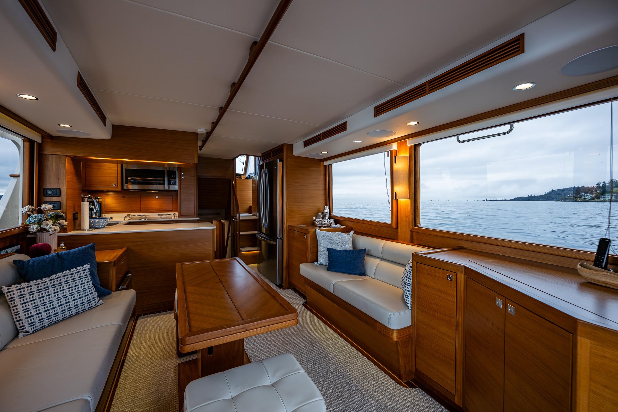 Luxurious interior of 2026 Fleming 55 Pilothouse yacht with ocean view.