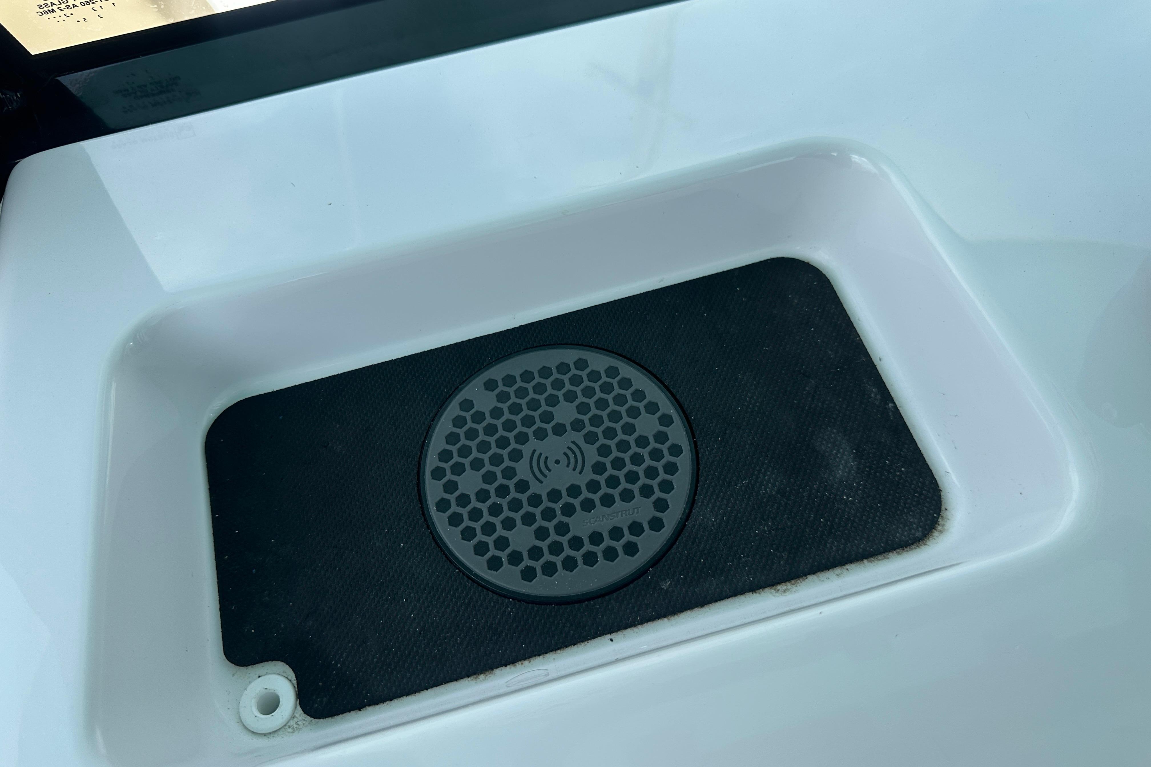 Wireless charging pad on 2026 Sportsman Open 232 Center Console boat.