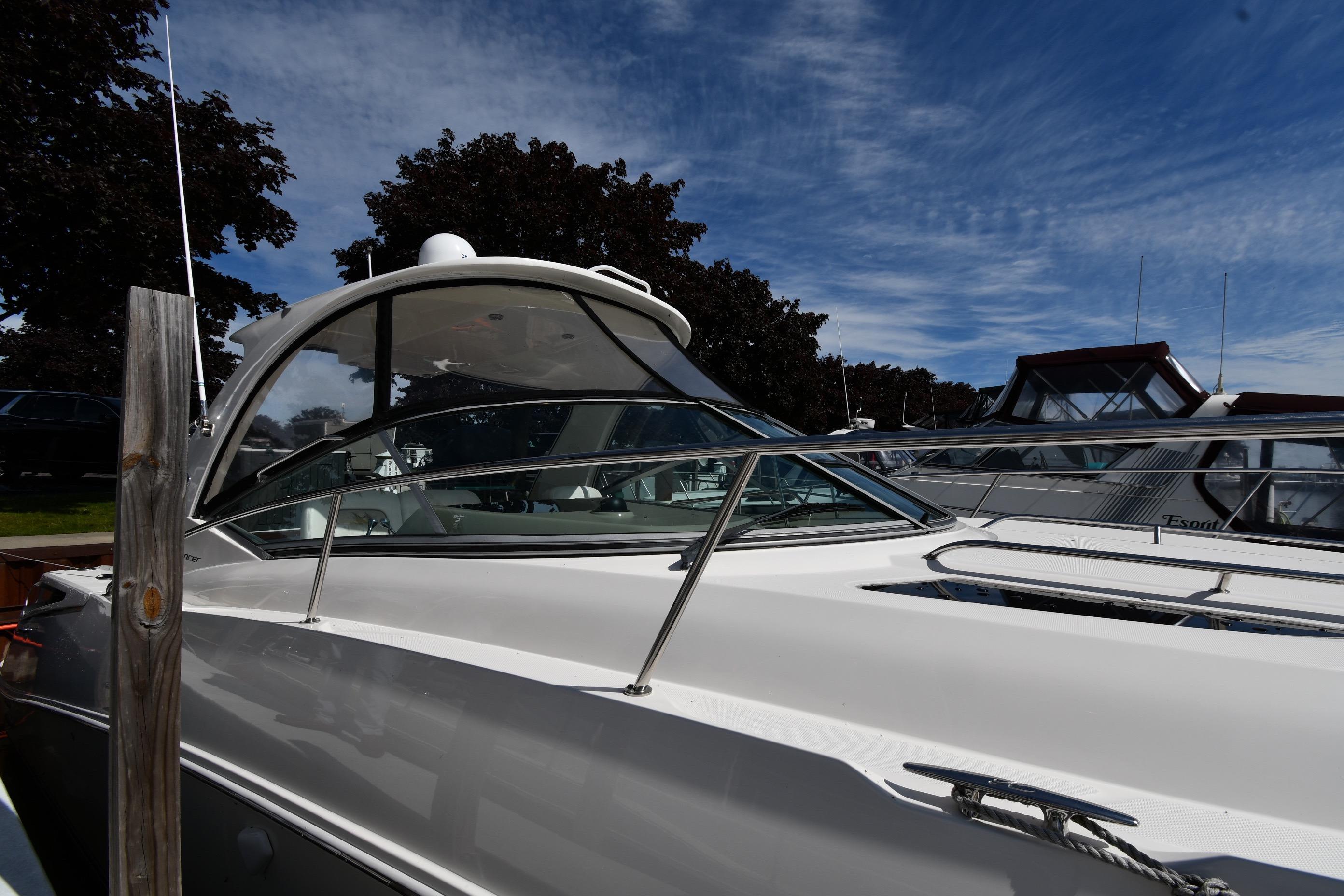 2008 Sea Ray Sundancer 350 yacht docked under a clear blue sky.