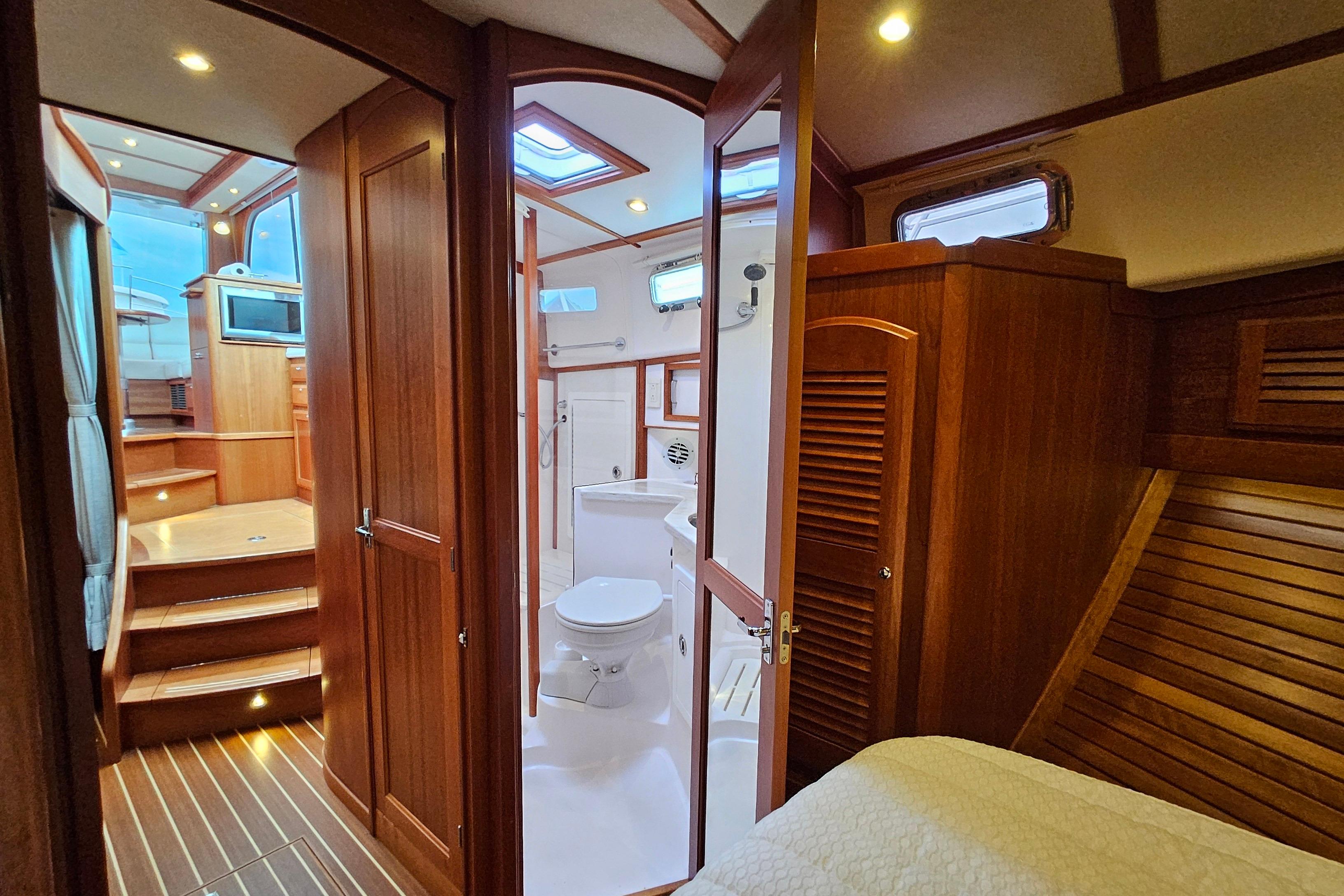 Luxurious interior of 2015 Sabre 42 Salon Express yacht with wood finish and modern amenities.