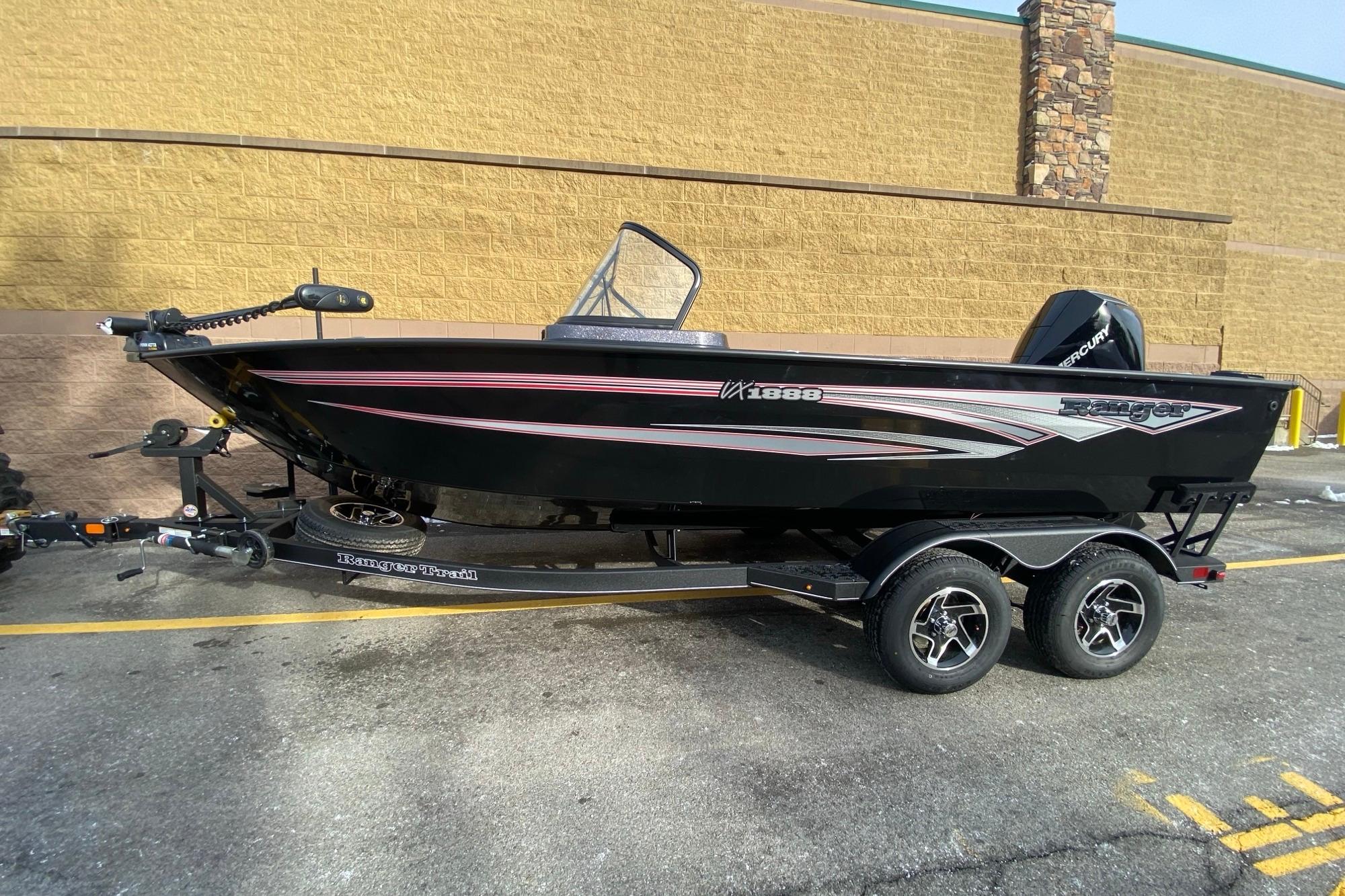2026 Ranger VX1888 WT boat on trailer, black with red accents, parked outdoors.