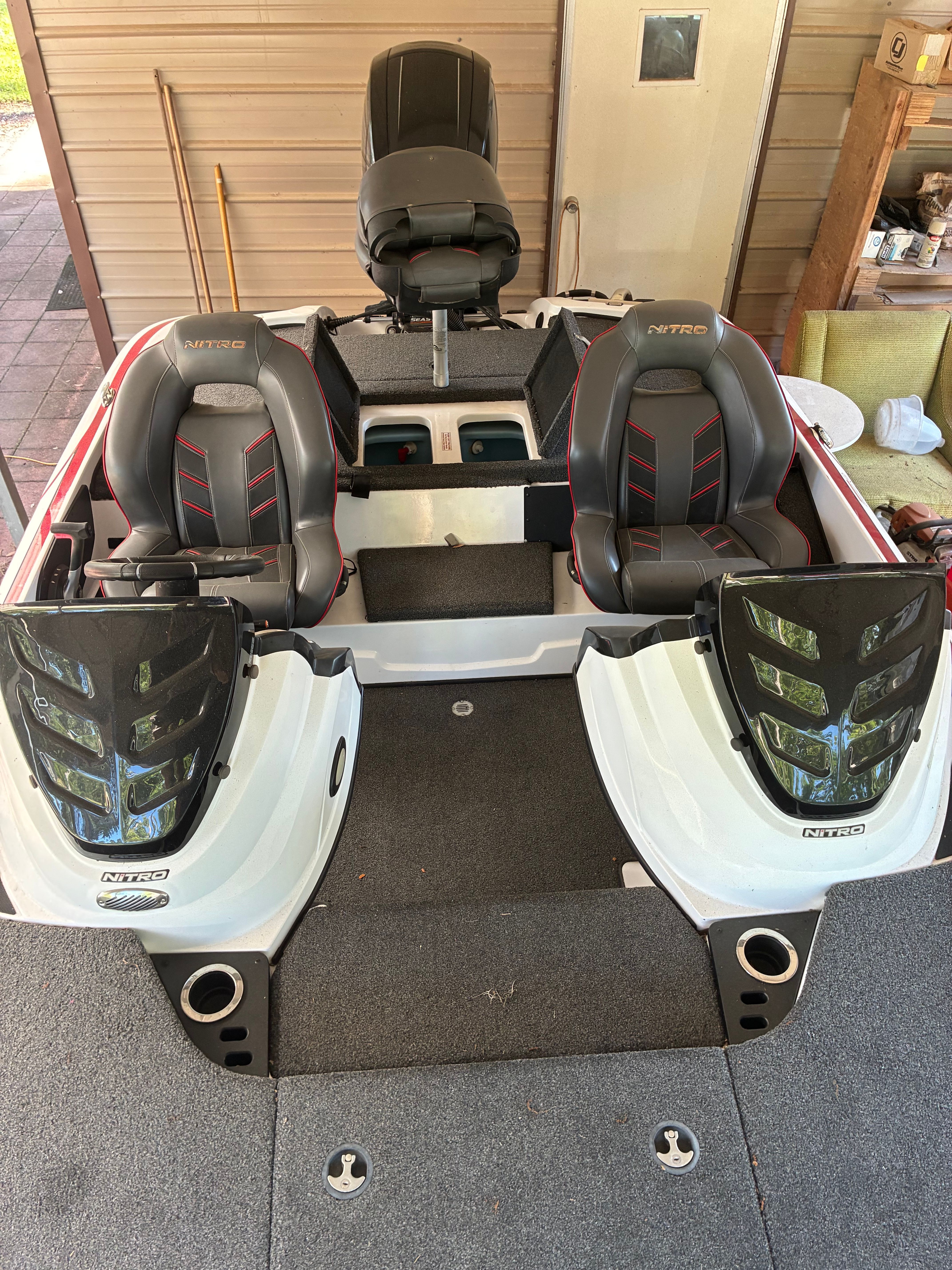 The image shows a Nitro Z18 boat with two seats and a steering console.
