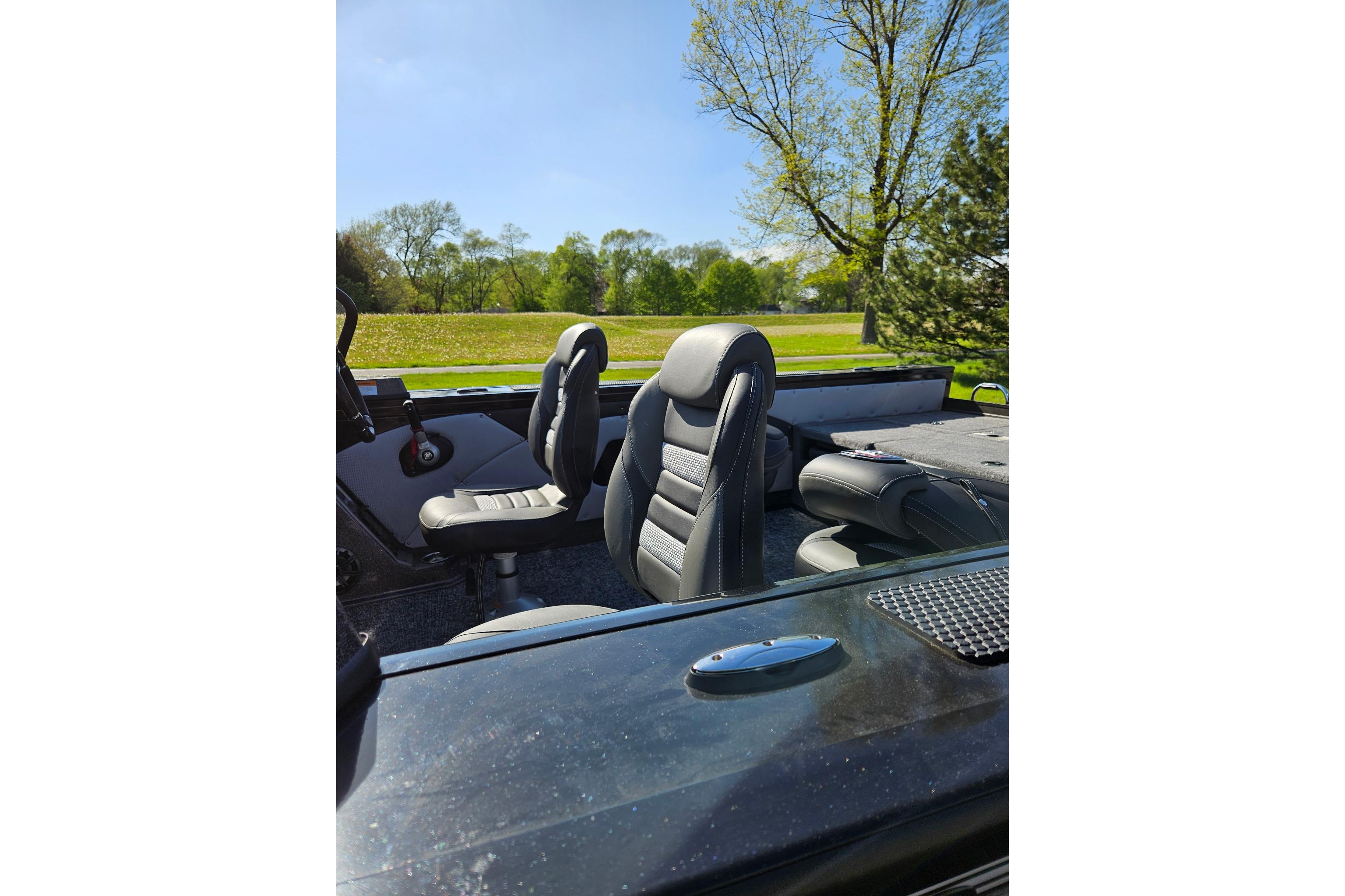 2026 Ranger VX1888 WT boat interior with sleek black seats and scenic background.