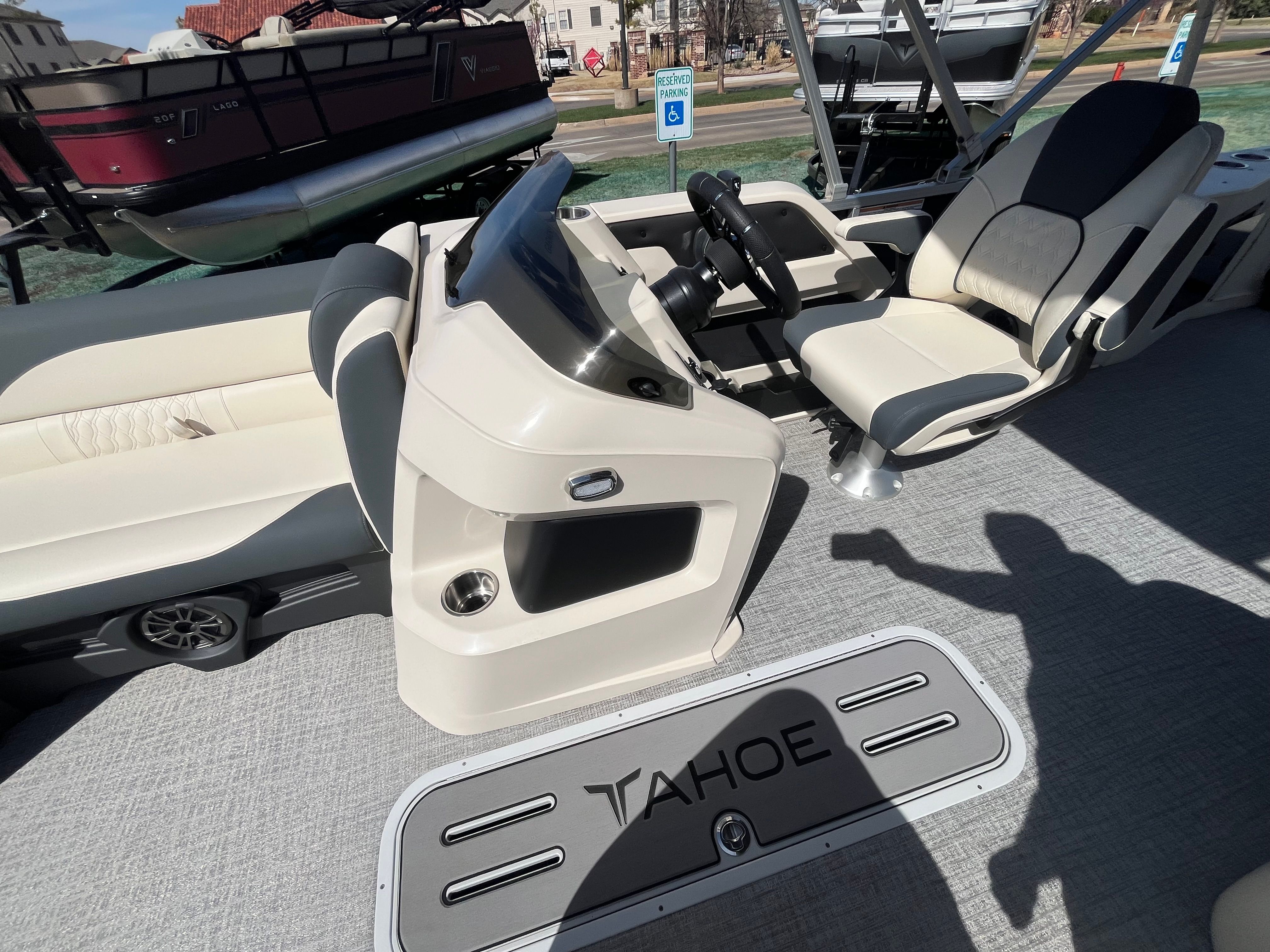 2026 Tahoe 2385 LTZ Cruise interior with helm console and seating bench.
