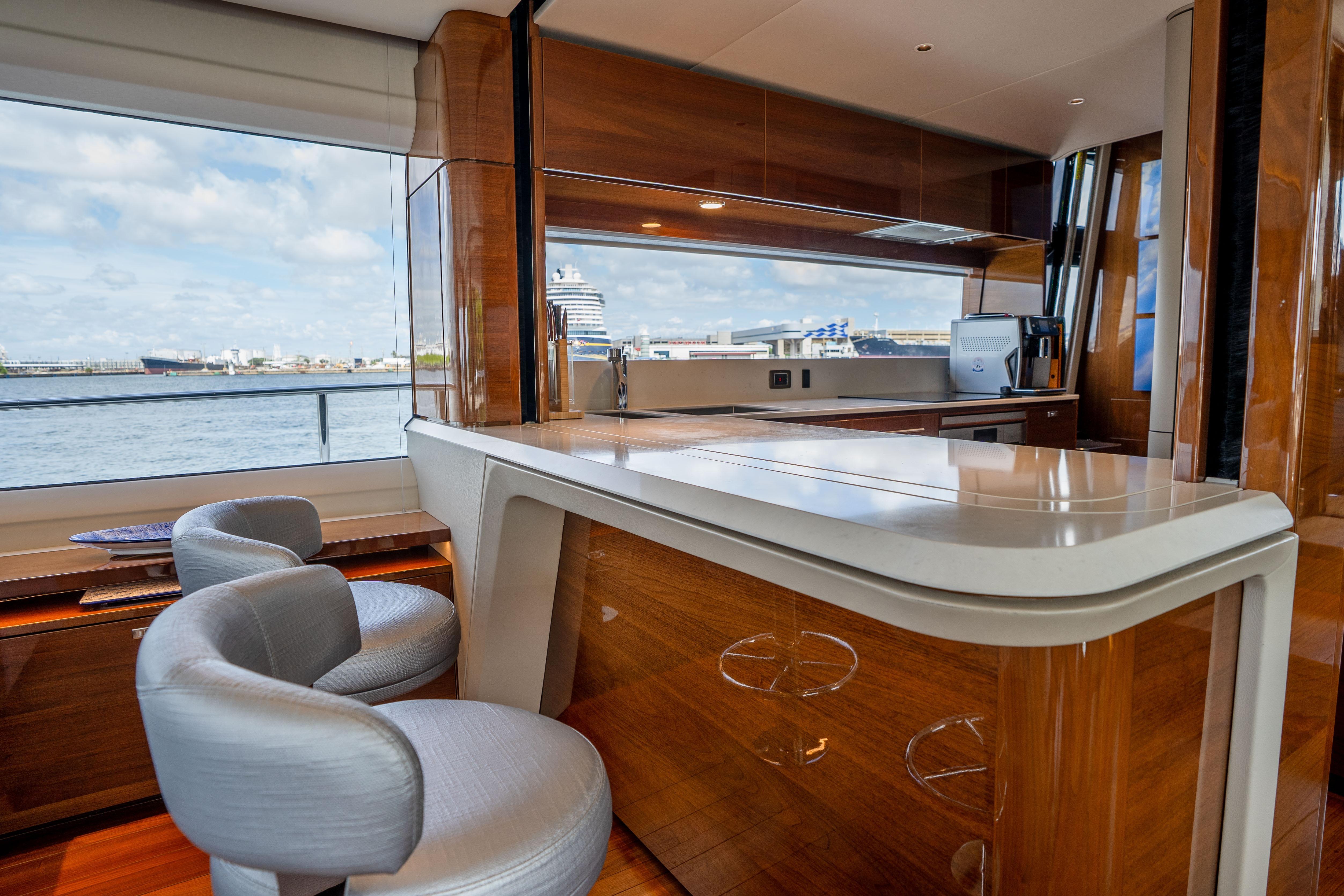 Luxurious interior of 2020 Princess Y85 yacht with elegant seating and panoramic ocean view.